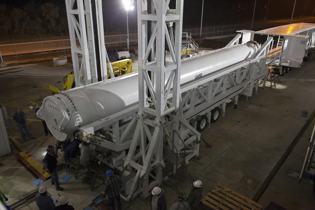 Technicians and engineers prepare to mate a solid rocket booster (SRB) to a United Launch Alliance Atlas V first stage in the Vertical Integration Facility at Space Launch Complex 41 at Cape Canaveral Air Force Station in Florida. The SRB will help boost NOAA's Geostationary Operational Environmental Satellite, or GOES-S, to orbit. GOES-S is the second in a series of four advanced geostationary weather satellites that will significantly improve the detection and observation of environmental phenomena that directly affect public safety, protection of property and the nation's economic health and prosperity. GOES-S is slated to launch March 1, 2018.