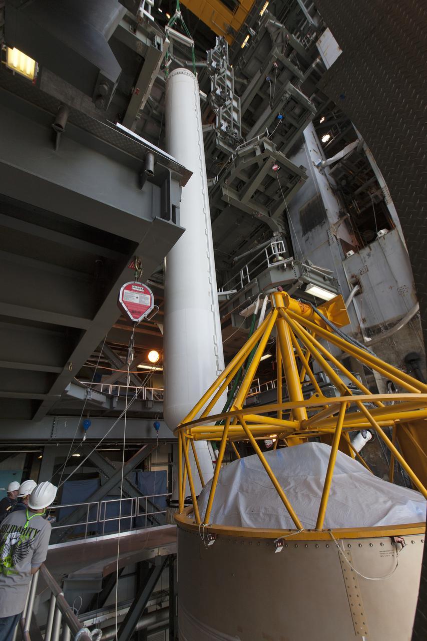 In the Vertical Integration Facility at Space Launch Complex 41 at Cape Canaveral Air Force Station in Florida, a solid rocket booster (SRB) is lifted by a crane for mating to a United Launch Alliance Atlas V first stage. The SRB will help boost NOAA's Geostationary Operational Environmental Satellite, or GOES-S, to orbit. GOES-S is the second in a series of four advanced geostationary weather satellites that will significantly improve the detection and observation of environmental phenomena that directly affect public safety, protection of property and the nation's economic health and prosperity. GOES-S is slated to launch March 1, 2018.