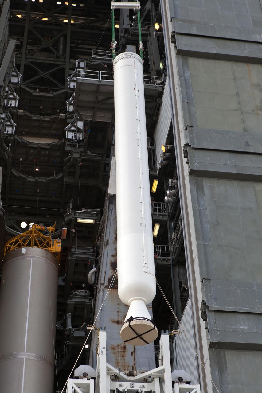 At the Vertical Integration Facility at Space Launch Complex 41 at Cape Canaveral Air Force Station in Florida, a solid rocket booster (SRB) is lifted by a crane for mating to a United Launch Alliance Atlas V first stage. The SRB will help boost NOAA's Geostationary Operational Environmental Satellite, or GOES-S, to orbit. GOES-S is the second in a series of four advanced geostationary weather satellites that will significantly improve the detection and observation of environmental phenomena that directly affect public safety, protection of property and the nation's economic health and prosperity. GOES-S is slated to launch March 1, 2018.