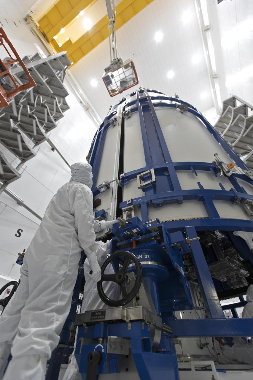 In a clean room at Astrotech Space Operations in Titusville, Florida, technicians and engineers monitor progress as NOAA's Geostationary Operational Environmental Satellite-S, or GOES-S, is encapsulated in its payload fairing. It soon will be moved to Space Launch Complex 41 at Cape Canaveral Air Force Station for mounting atop the Atlas V rocket that will boost the satellite to orbit. GOES-S is the second in a series of four advanced geostationary weather satellites that will significantly improve the detection and observation of environmental phenomena that directly affect public safety, protection of property and the nation's economic health and prosperity. GOES-S is slated to launch March 1, 2018 aboard a United Launch Alliance Atlas V rocket.