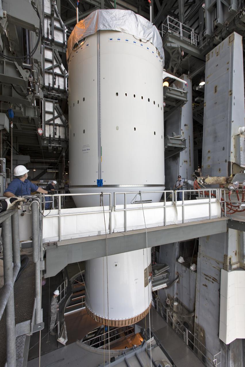 At the Vertical Integration Facility at Space Launch Complex 41 at Cape Canaveral Air Force Station in Florida, technicians and engineers monitor progress as a Centaur upper stage is mated to a United Launch Alliance Atlas V rocket that will boost NOAA's Geostationary Operational Environmental Satellite-S, or GOES-S, to orbit. GOES-S is the second in a series of four advanced geostationary weather satellites that will significantly improve the detection and observation of environmental phenomena that directly affect public safety, protection of property and the nation's economic health and prosperity. GOES-S is slated to launch March 1, 2018.