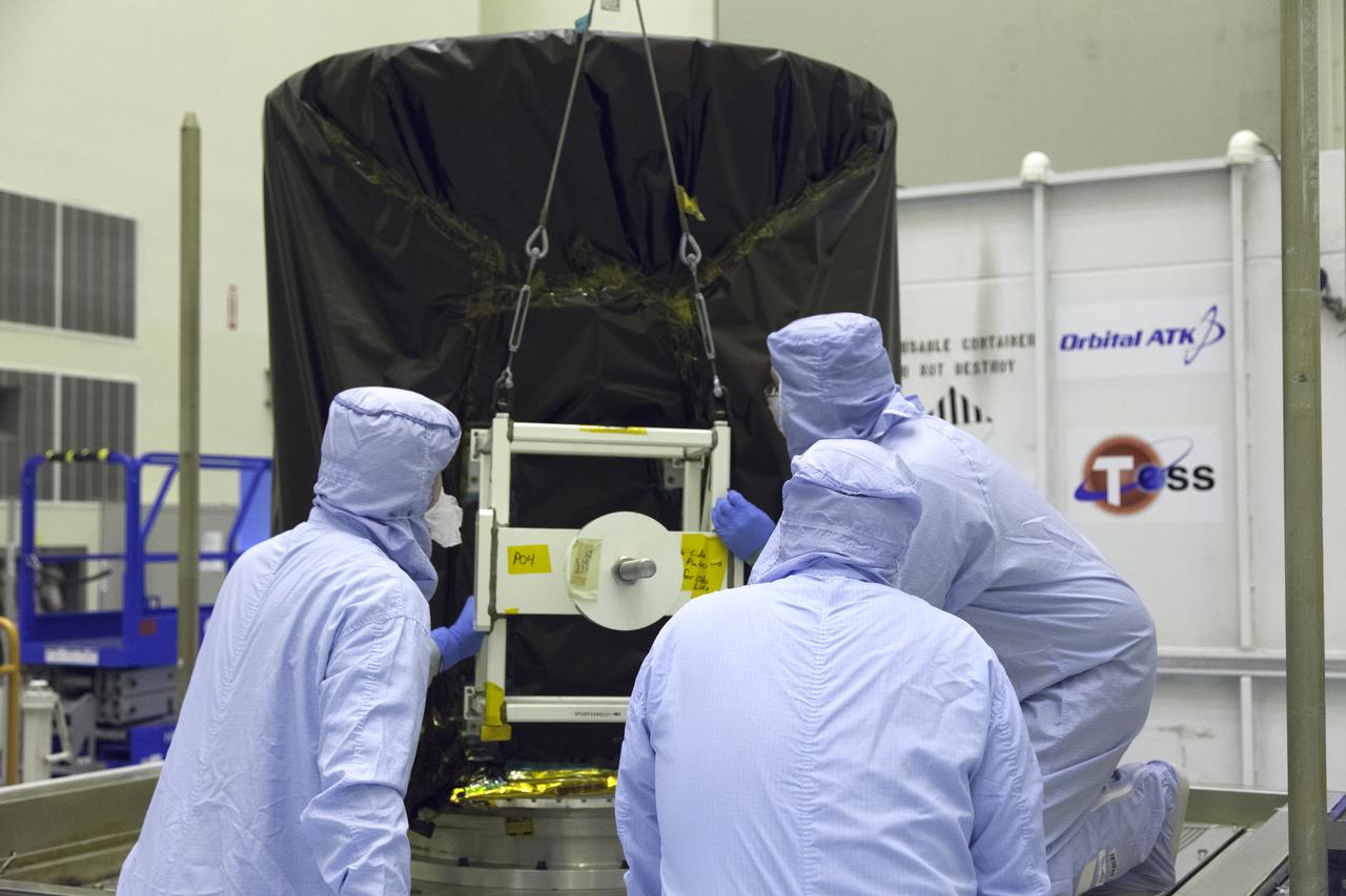 NASA's Transiting Exoplanet Survey Satellite (TESS) is lifted up from the base of its shipping container and will be lowered onto a test stand for processing inside the Payload Hazardous Servicing Facility (PHSF) at the agency's Kennedy Space Center in Florida. Inside the PHSF, the satellite will be processed and prepared for its flight. TESS is scheduled to launch atop a SpaceX Falcon 9 rocket from Space Launch Complex 40 at Cape Canaveral Air Force Station. TESS is the next step in NASA's search for planets outside our solar system, known as exoplanets. TESS is a NASA Astrophysics Explorer mission led and operated by MIT in Cambridge, Massachusetts, and managed by NASA’s Goddard Space Flight Center in Greenbelt, Maryland. Dr. George Ricker of MIT’s Kavli Institute for Astrophysics and Space Research serves as principal investigator for the mission. Additional partners include Orbital ATK, NASA’s Ames Research Center, the Harvard-Smithsonian Center for Astrophysics and the Space Telescope Science Institute. More than a dozen universities, research institutes and observatories worldwide are participants in the mission. NASA’s Launch Services Program is responsible for launch management. 