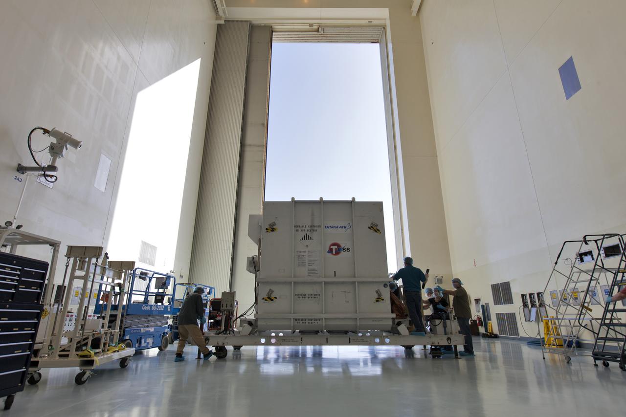 The shipping container with NASA's Transiting Exoplanet Survey Satellite (TESS) inside, is moved into the Payload Hazardous Servicing Facility (PHSF) at the agency's Kennedy Space Center in Florida. Inside the PHSF, the satellite will be processed and prepared for its flight. TESS is scheduled to launch atop a SpaceX Falcon 9 rocket from Space Launch Complex 40 at Cape Canaveral Air Force Station. TESS is the next step in NASA's search for planets outside our solar system, known as exoplanets. TESS is a NASA Astrophysics Explorer mission led and operated by MIT in Cambridge, Massachusetts, and managed by NASA’s Goddard Space Flight Center in Greenbelt, Maryland. Dr. George Ricker of MIT’s Kavli Institute for Astrophysics and Space Research serves as principal investigator for the mission. Additional partners include Orbital ATK, NASA’s Ames Research Center, the Harvard-Smithsonian Center for Astrophysics and the Space Telescope Science Institute. More than a dozen universities, research institutes and observatories worldwide are participants in the mission. NASA’s Launch Services Program is responsible for launch management. 