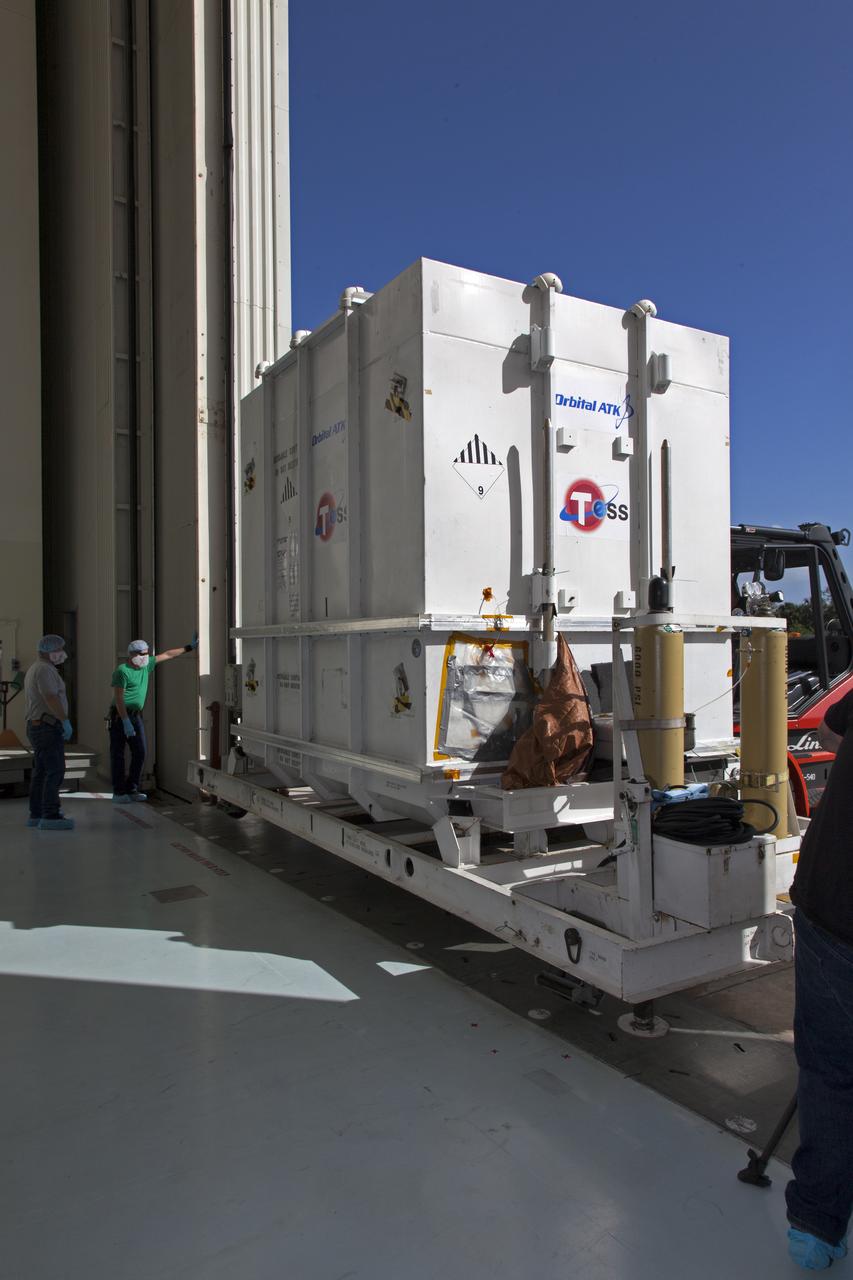 The shipping container with NASA's Transiting Exoplanet Survey Satellite (TESS) inside, is moved into the Payload Hazardous Servicing Facility (PHSF) at the agency's Kennedy Space Center in Florida. Inside the PHSF, the satellite will be processed and prepared for its flight. TESS is scheduled to launch atop a SpaceX Falcon 9 rocket from Space Launch Complex 40 at Cape Canaveral Air Force Station. TESS is the next step in NASA's search for planets outside our solar system, known as exoplanets. TESS is a NASA Astrophysics Explorer mission led and operated by MIT in Cambridge, Massachusetts, and managed by NASA’s Goddard Space Flight Center in Greenbelt, Maryland. Dr. George Ricker of MIT’s Kavli Institute for Astrophysics and Space Research serves as principal investigator for the mission. Additional partners include Orbital ATK, NASA’s Ames Research Center, the Harvard-Smithsonian Center for Astrophysics and the Space Telescope Science Institute. More than a dozen universities, research institutes and observatories worldwide are participants in the mission. NASA’s Launch Services Program is responsible for launch management. 