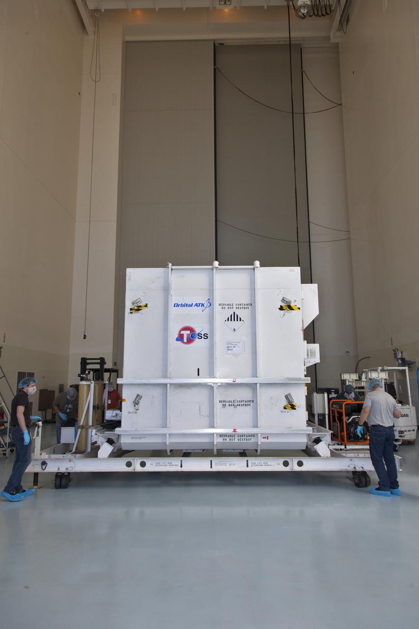 The shipping container with NASA's Transiting Exoplanet Survey Satellite (TESS) inside, is moved into the Payload Hazardous Servicing Facility (PHSF) at the agency's Kennedy Space Center in Florida. Inside the PHSF, the satellite will be processed and prepared for its flight. TESS is scheduled to launch atop a SpaceX Falcon 9 rocket from Space Launch Complex 40 at Cape Canaveral Air Force Station. TESS is the next step in NASA's search for planets outside our solar system, known as exoplanets. TESS is a NASA Astrophysics Explorer mission led and operated by MIT in Cambridge, Massachusetts, and managed by NASA’s Goddard Space Flight Center in Greenbelt, Maryland. Dr. George Ricker of MIT’s Kavli Institute for Astrophysics and Space Research serves as principal investigator for the mission. Additional partners include Orbital ATK, NASA’s Ames Research Center, the Harvard-Smithsonian Center for Astrophysics and the Space Telescope Science Institute. More than a dozen universities, research institutes and observatories worldwide are participants in the mission. NASA’s Launch Services Program is responsible for launch management. 