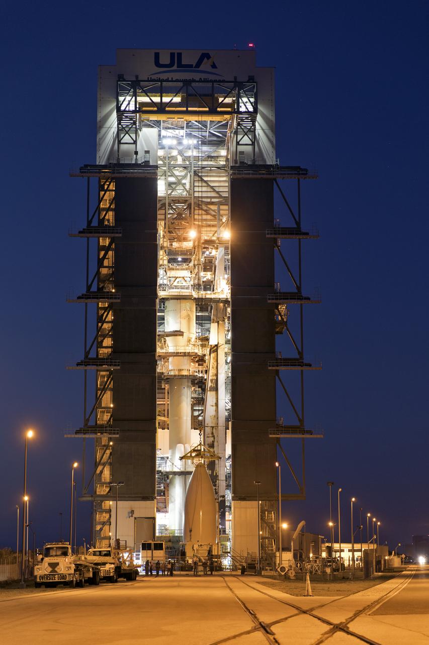 A crane has been attached to the payload fairing containing NOAA's Geostationary Operational Environmental Satellite-S (GOES-S) at the United Launch Alliance (ULA) Vertical Integration Facility at Space Launch Complex 41 at Cape Canaveral Air Force Station in Florida. The fairing will be lifted and mated to the ULA Atlas V rocket. GOES-S is the second in a series of four advanced geostationary weather satellites. The satellite is slated to launch aboard the ULA Atlas V on March 1. 