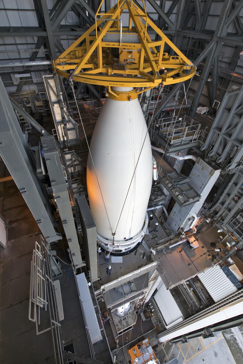 A view from above shows the payload fairing containing NOAA's Geostationary Operational Environmental Satellite-S (GOES-S) lifted and moved into the United Launch Alliance (ULA) Vertical Integration Facility at Space Launch Complex 41 at Cape Canaveral Air Force Station in Florida. The fairing will be lowered and secured on the ULA Atlas V rocket. GOES-S is the second in a series of four advanced geostationary weather satellites. The satellite is slated to launch aboard the ULA Atlas V on March 1.