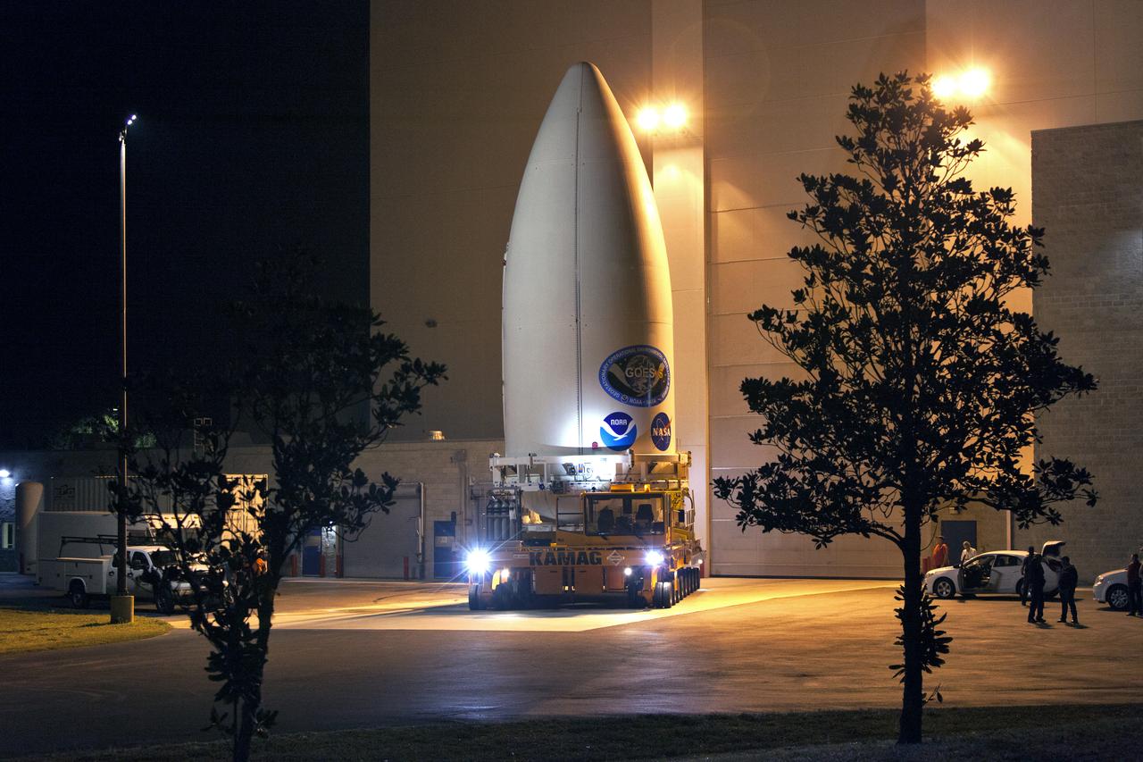 The payload fairing containing NOAA's Geostationary Operational Environmental Satellite-S (GOES-S), secured on a transporter, departs the Astrotech Space Operations facility in Titusville, Florida. GOES-S will be transported to the United Launch Alliance (ULA) Vertical Integration Facility at Space Launch Complex 41 at Cape Canaveral Air Force Station in Florida. The payload fairing will be lifted and mated to the ULA Atlas V rocket. GOES-S is the second in a series of four advanced geostationary weather satellites. GOES-S is slated to launch aboard the ULA Atlas V on March 1. 