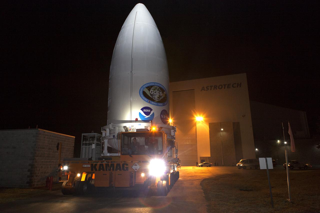 The payload fairing containing NOAA's Geostationary Operational Environmental Satellite-S (GOES-S), secured on a transporter, departs the Astrotech Space Operations facility in Titusville, Florida. GOES-S will be transported to the United Launch Alliance (ULA) Vertical Integration Facility at Space Launch Complex 41 at Cape Canaveral Air Force Station in Florida. The payload fairing will be lifted and mated to the ULA Atlas V rocket. GOES-S is the second in a series of four advanced geostationary weather satellites. GOES-S is slated to launch aboard the ULA Atlas V on March 1. 