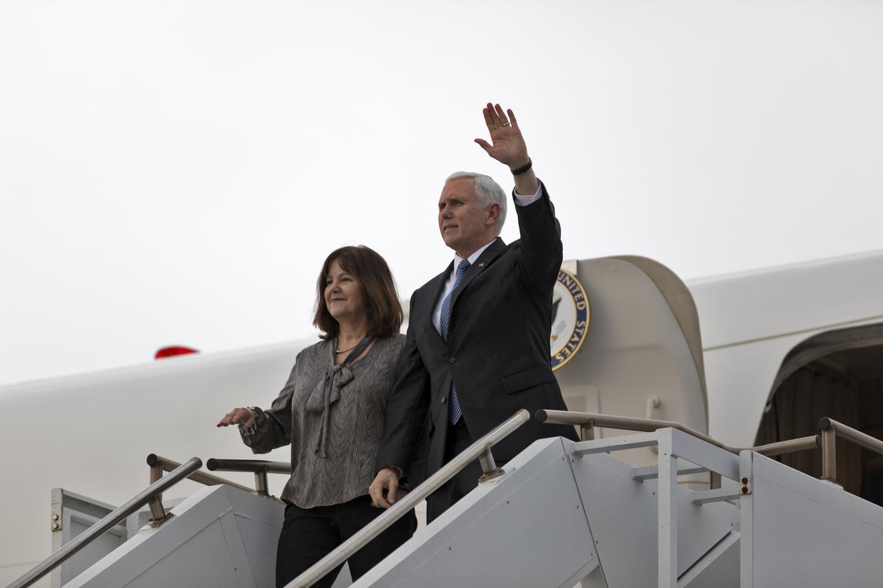 Vice President Mike Pence and his wife, Karen, step off Air Force Two on the Shuttle Landing Facility at NASA's Kennedy Space Center in Florida, on Feb. 20, 2018. During his visit, Pence will chair a meeting of the National Space Council in the high bay of the center's Space Station Processing Facility. The council's role is to advise the president regarding national space policy and strategy, and review the nation's long-range goals for space activities.