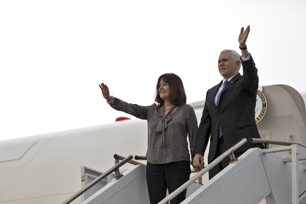 Vice President Mike Pence and his wife, Karen, step off Air Force Two on the Shuttle Landing Facility at NASA's Kennedy Space Center in Florida, on Feb. 20, 2018. During his visit, Pence will chair a meeting of the National Space Council in the high bay of the center's Space Station Processing Facility. The council's role is to advise the president regarding national space policy and strategy, and review the nation's long-range goals for space activities.