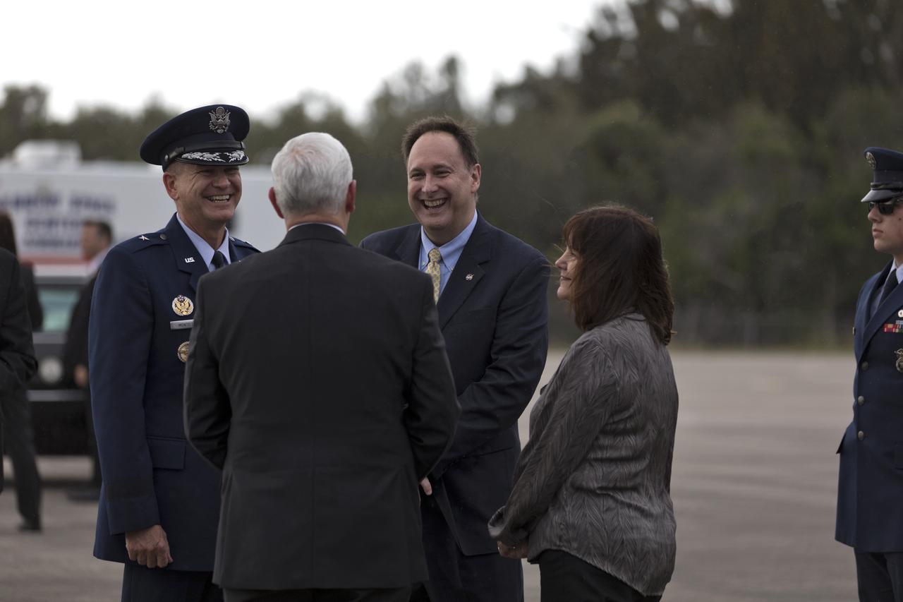 Acting NASA Administrator Robert Lightfoot, center, greets Vice President Mike Pence and his wife, Karen, at the Shuttle Landing Facility at the agency's Kennedy Space Center in Florida, on Feb. 20, 2018. During his visit, Pence will chair a meeting of the National Space Council in the high bay of the center's Space Station Processing Facility. The council's role is to advise the president regarding national space policy and strategy, and review the nation's long-range goals for space activities.