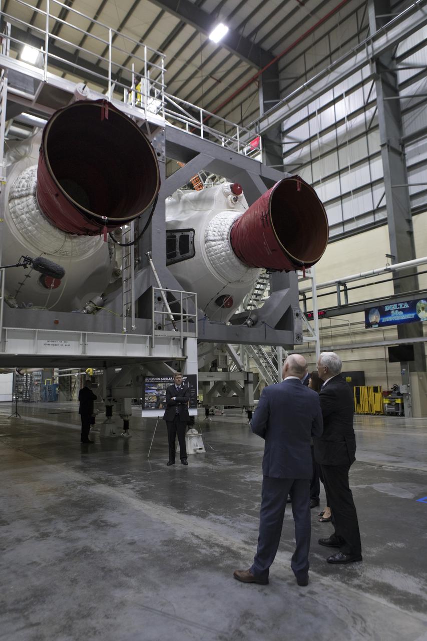 United Launch Alliance (ULA) president and CEO Tory Bruno, left, leads a tour in the ULA Horizontal Integration Facility (HIF), at Cape Canaveral Air Force Station in Florida for Vice President Mike Pence on Feb. 20, 2018. The HIF is where the Delta IV Heavy boosters are being processed for NASA’s upcoming Parker Solar Probe mission. During his visit, Pence will chair a meeting of the National Space Council on Feb. 21, 2018 in the high bay of NASA Kennedy Space Center’s Space Station Processing Facility. The council's role is to advise the president regarding national space policy and strategy, and review the nation's long-range goals for space activities.