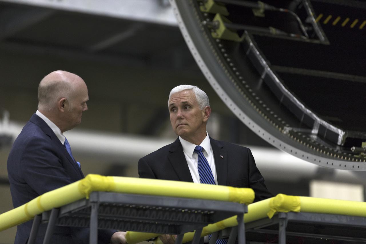 United Launch Alliance (ULA) president and CEO Tory Bruno, left, leads a tour for Vice President Mike Pence on Feb. 20, 2018. They are in the ULA Horizontal Integration Facility (HIF), at Cape Canaveral Air Force Station in Florida. The HIF is where the Delta IV Heavy boosters are being processed for NASA’s upcoming Parker Solar Probe mission. During his visit, Pence will chair a meeting of the National Space Council on Feb. 21, 2018 in the high bay of NASA Kennedy Space Center’s Space Station Processing Facility. The council's role is to advise the president regarding national space policy and strategy, and review the nation's long-range goals for space activities.