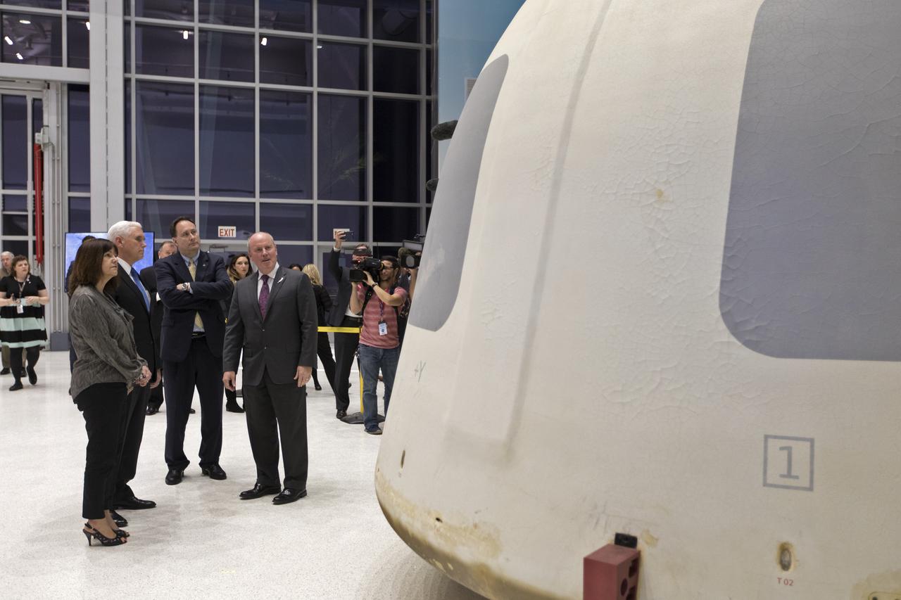 Vice President Mike Pence, second from left, tours the Blue Origin Manufacturing Facility near NASA's Kennedy Space Center in Florida, on Feb. 20, 2018. At far left is the vice president's wife, Karen Pence. To the right of Vice President Pence are acting NASA Administrator Robert Lightfoot and Blue Origin CEO Robert Smith. Pence viewed the flown New Shepard Booster and Crew Capsule. The Crew Capsule, in view, flew seven times, including a pad abort test and an escape test at maximum dynamic pressure. During his visit, Pence will chair a meeting of the National Space Council on Feb. 21, 2018 in the high bay of NASA Kennedy Space Center's Space Station Processing Facility. The council's role is to advise the president regarding national space policy and strategy, and review the nation's long-range goals for space activities. 