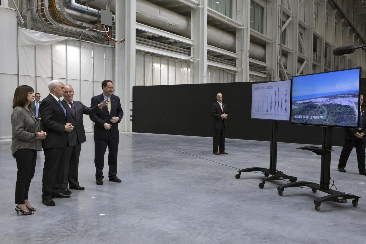 Vice President Mike Pence, second from left, tours the Blue Origin Manufacturing Facility near NASA's Kennedy Space Center in Florida, on Feb. 20, 2018. At left is the vice president's wife, Karen Pence. To his right are Blue Origin CEO Robert Smith, and acting NASA Administrator Robert Lightfoot. Vice President Pence viewed the flown New Shepard Booster and Crew Capsule. The booster was the first launch vehicle with a successful vertical takeoff and vertical landing to demonstrate reusability. During his visit, Pence will chair a meeting of the National Space Council on Feb. 21, 2018 in the high bay of NASA Kennedy Space Center's Space Station Processing Facility. The council's role is to advise the president regarding national space policy and strategy, and review the nation's long-range goals for space activities.