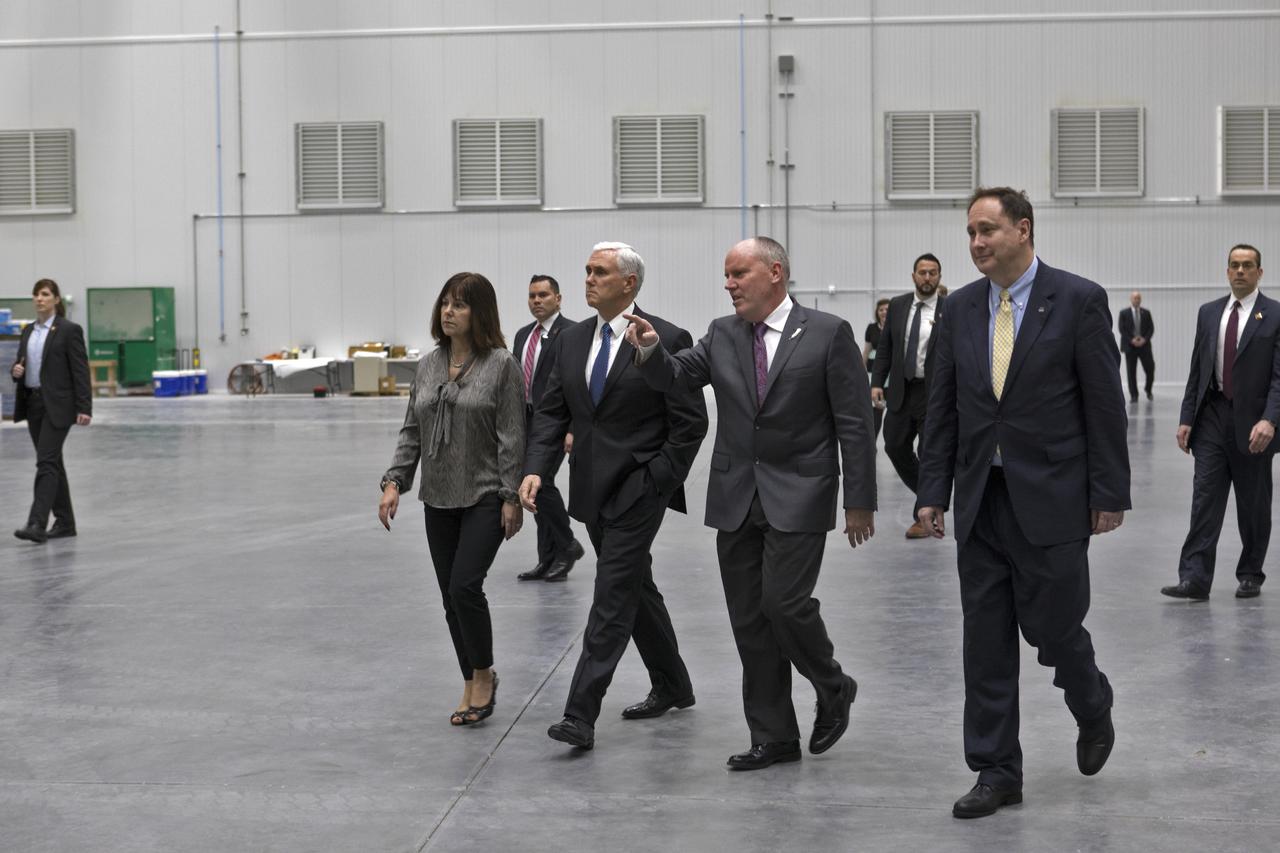 Vice President Mike Pence, second from left, tours the Blue Origin Manufacturing Facility near NASA's Kennedy Space Center in Florida, on Feb. 20, 2018. At left is the vice president's wife, Karen Pence. To his right are Blue Origin CEO Robert Smith, and acting NASA Administrator Robert Lightfoot. Vice President Pence viewed the flown New Shepard Booster and Crew Capsule. The booster was the first launch vehicle with a successful vertical takeoff and vertical landing to demonstrate reusability. During his visit, Pence will chair a meeting of the National Space Council on Feb. 21, 2018 in the high bay of NASA Kennedy Space Center's Space Station Processing Facility. The council's role is to advise the president regarding national space policy and strategy, and review the nation's long-range goals for space activities. 