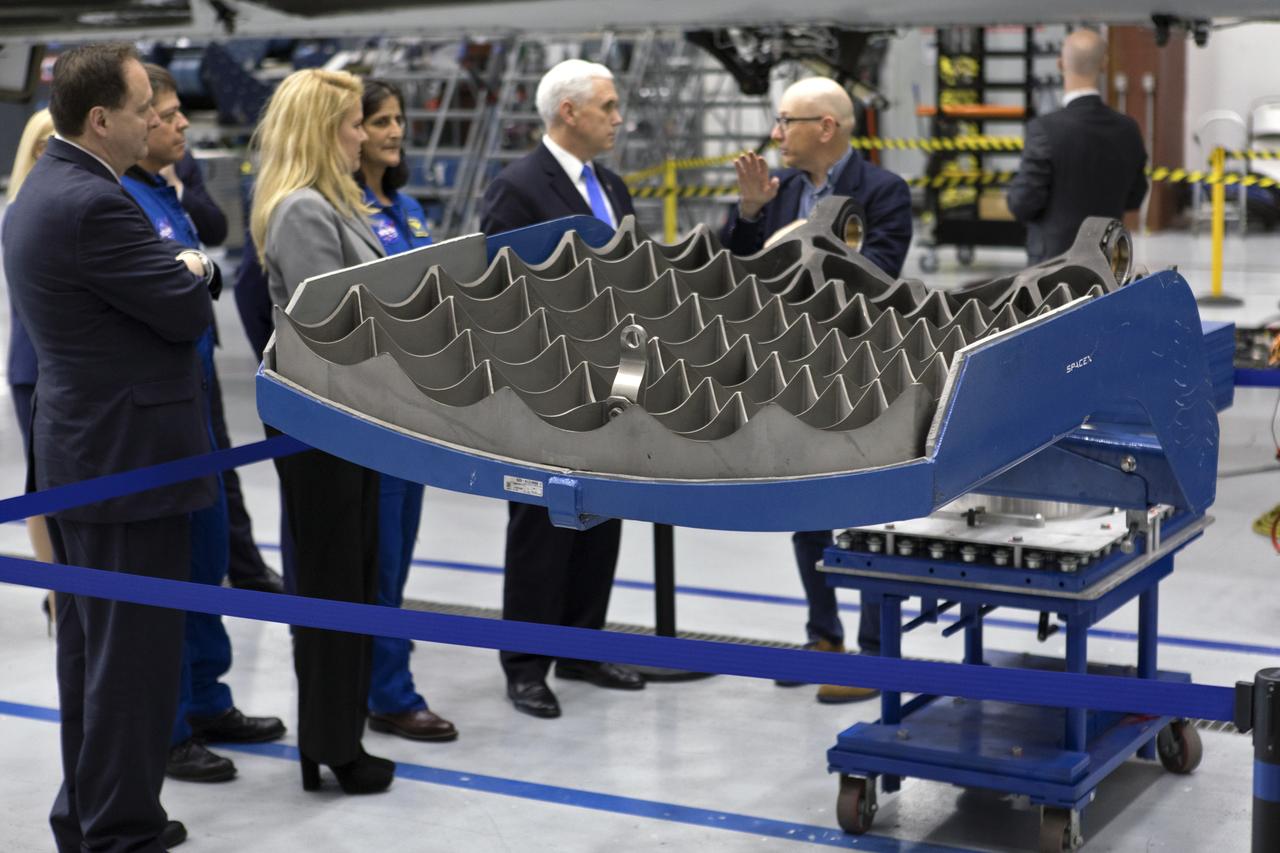 Vice President Mike Pence tours the SpaceX hangar at Launch Complex 39A, at NASA's Kennedy Space Center in Florida, on Feb. 21, 2018. SpaceX Director of Launch Pads John Muratore, far right, describes hardware to, from the left Acting NASA Administrator Robert Lightfoot, SpaceX President and COO Gwynne Shotwell, NASA astronaut Suni Williams and Pence. During his visit, Pence chaired a meeting of the National Space Council in the high bay of the center's Space Station Processing Facility. The council's role is to advise the president regarding national space policy and strategy, and review the nation's long-range goals for space activities.
