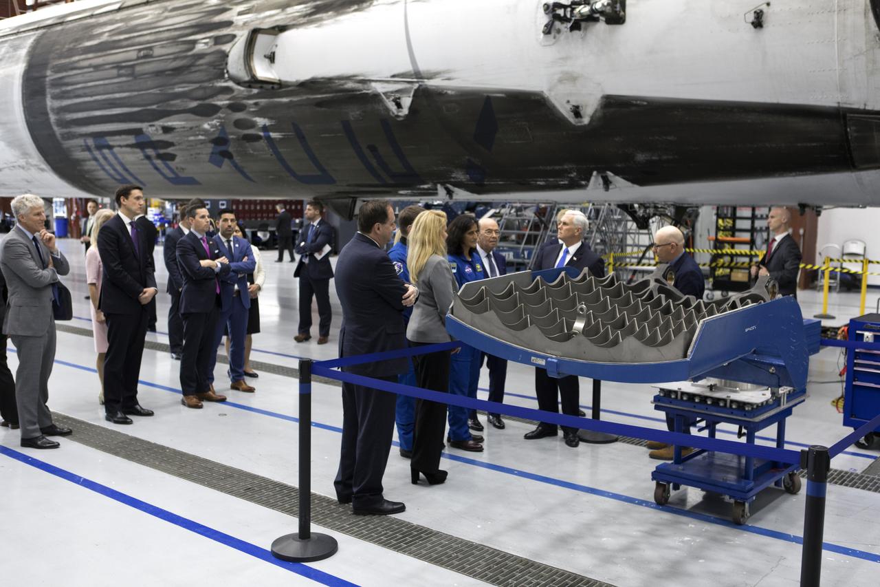 Vice President Mike Pence tours the SpaceX hangar at Launch Complex 39A, at NASA's Kennedy Space Center in Florida, on Feb. 21, 2018. SpaceX Director of launch Pads John Muratore, far right, describes hardware to, from the left Acting NASA Administrator Robert Lightfoot, SpaceX President and COO Gwynne Shotwell, NASA astronaut Suni Williams and Pence. During his visit, Pence chaired a meeting of the National Space Council in the high bay of the center's Space Station Processing Facility. The council's role is to advise the president regarding national space policy and strategy, and review the nation's long-range goals for space activities.