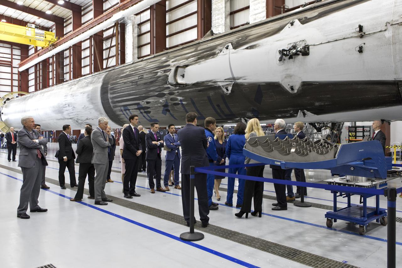 Vice President Mike Pence tours the SpaceX hangar at Launch Complex 39A, at NASA's Kennedy Space Center in Florida, on Feb. 21, 2018. The group is getting a close-up look at a previously flown Falcon 9 rocket. During his visit, Pence chaired a meeting of the National Space Council in the high bay of the center's Space Station Processing Facility. The council's role is to advise the president regarding national space policy and strategy, and review the nation's long-range goals for space activities.
