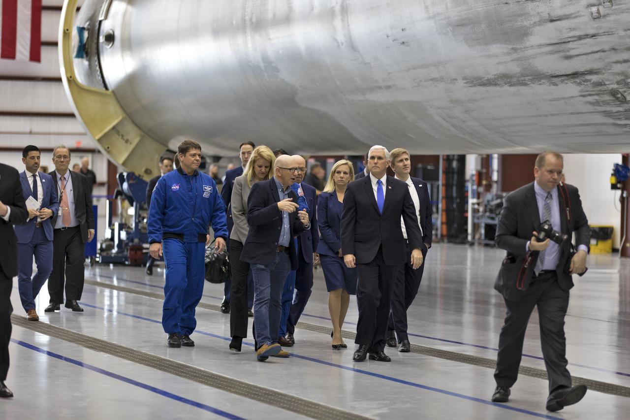 Vice President Mike Pence tours the SpaceX hangar at Launch Complex 39A, at NASA's Kennedy Space Center in Florida, on Feb. 21, 2018. The group is getting a close-up look at a previously flown Falcon 9 rocket. During his visit, Pence chaired a meeting of the National Space Council in the high bay of the center's Space Station Processing Facility. The council's role is to advise the president regarding national space policy and strategy, and review the nation's long-range goals for space activities.