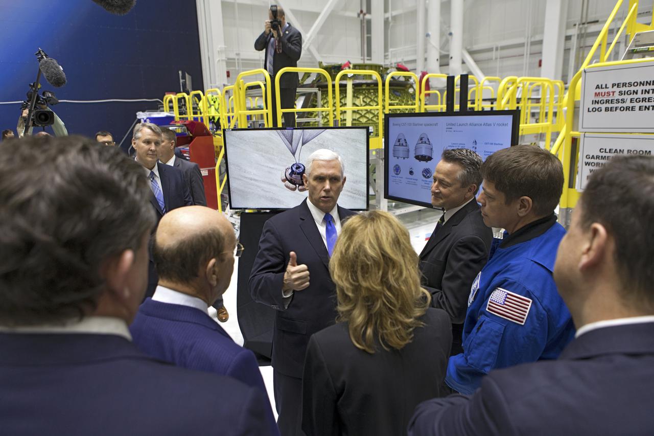 Vice President Mike Pence, center, speaks to Boeing executives and members of the National Space Council during a tour of the Boeing Commercial Crew and Cargo Processing Facility at NASA's Kennedy Space Center in Florida, on Feb. 21, 2018. During his visit, Pence chaired a meeting of the council in the high bay of the center's Space Station Processing Facility. The council's role is to advise the president regarding national space policy and strategy, and review the nation's long-range goals for space activities.