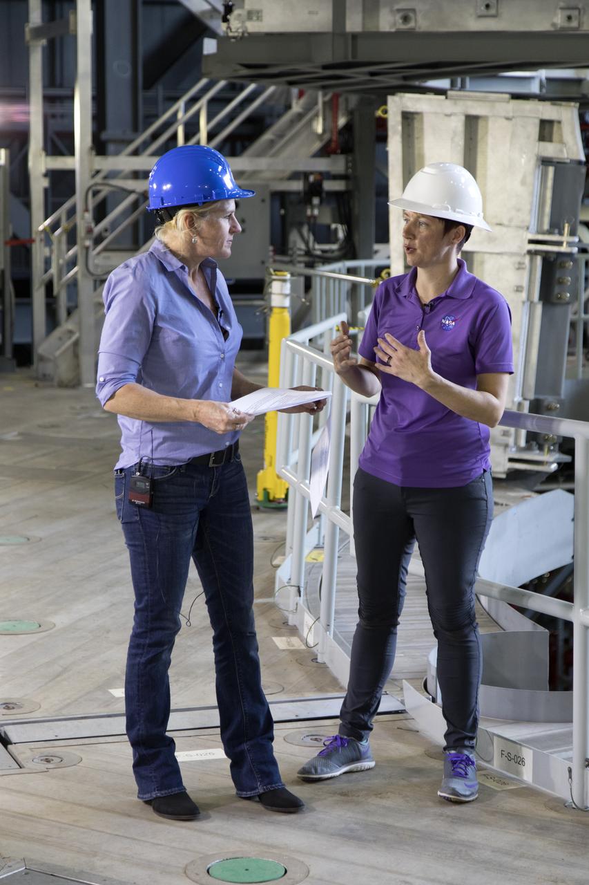 NASA engineer Krista Shaffer, left, speaks to Rachel Power of NASA’s Digital Expansion to Engage the Public (DEEP) Network inside Kennedy Space Center’s Vehicle Assembly Building during Introduce a Girl to Engineering Day. Held in conjunction with National Engineers Week and Girl Day, the event allowed students from throughout the nation to speak with female NASA scientists and technical experts.