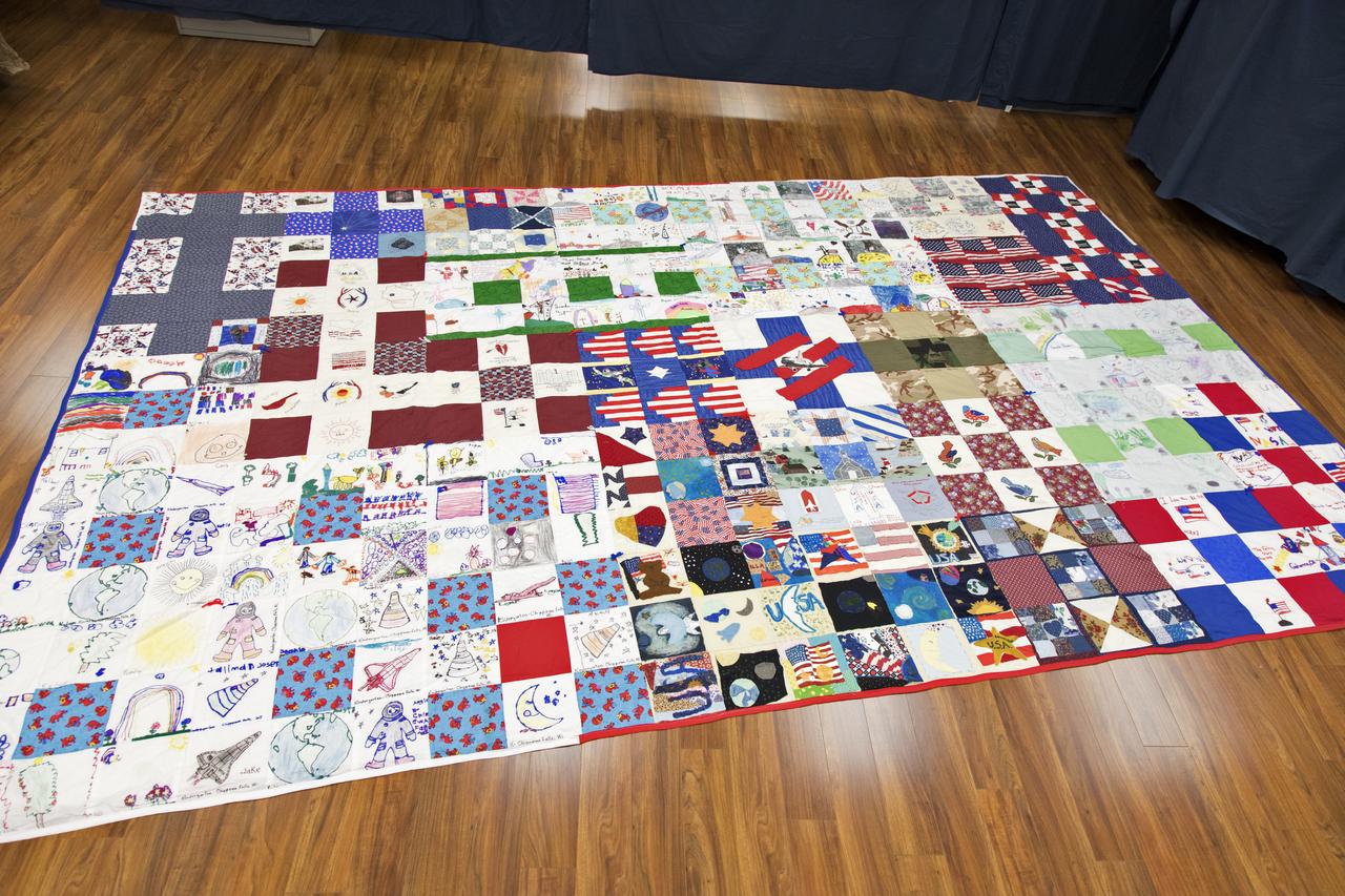 A giant hand-made quilt in honor of space shuttle Columbia and her crew was turned over to the Columbia Preservation Room inside the Vehicle Assembly Building at NASA's Kennedy Space Center in Florida. The quilt was made by Katherine Walsh, a lifelong NASA and space program fan originally from Kentucky. 