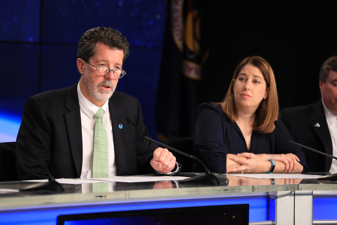 In the Kennedy Space Center's Press Site auditorium, Jim Roberts, a scientist with the Earth System Research Laboratory's Office of Atmospheric Research for NOAA, left, and Kristin Calhoun, a research scientist with NOAA's National Severe Storms Laboratory, speak to members of the media at a mission briefing on National Oceanic and Atmospheric Administration's, or NOAA's, Geostationary Operational Environmental Satellite, or GOES-S. The spacecraft is the second satellite in a series of next-generation NOAA weather satellites. It will launch to a geostationary position over the U.S. to provide images of storms and help predict weather forecasts, severe weather outlooks, watches, warnings, lightning conditions and longer-term forecasting. GOES-S is slated to lift off at 5:02 p.m. EST on March 1, 2018 aboard a United Launch Alliance Atlas V rocket.