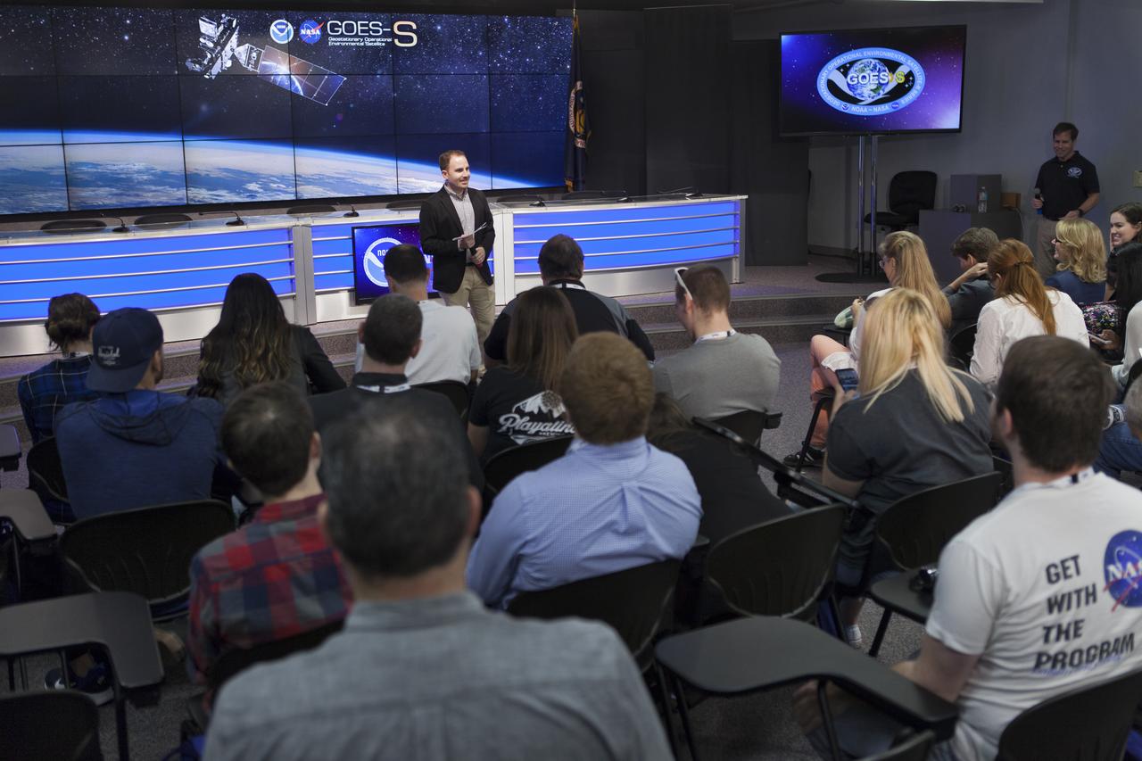 Jason Townsend, NASA's social media manager, speaks to members of social media in the Kennedy Space Center’s Press Site auditorium. The briefing focused on the National Oceanic and Atmospheric Administration's, or NOAA's, Geostationary Operational Environmental Satellite, or GOES-S. The spacecraft is the second satellite in a series of next-generation NOAA weather satellites. It will launch to a geostationary position over the U.S. to provide images of storms and help predict weather forecasts, severe weather outlooks, watches, warnings, lightning conditions and longer-term forecasting. GOES-S is slated to lift off at 5:02 p.m. EST on March 1, 2018 aboard a United Launch Alliance Atlas V rocket.