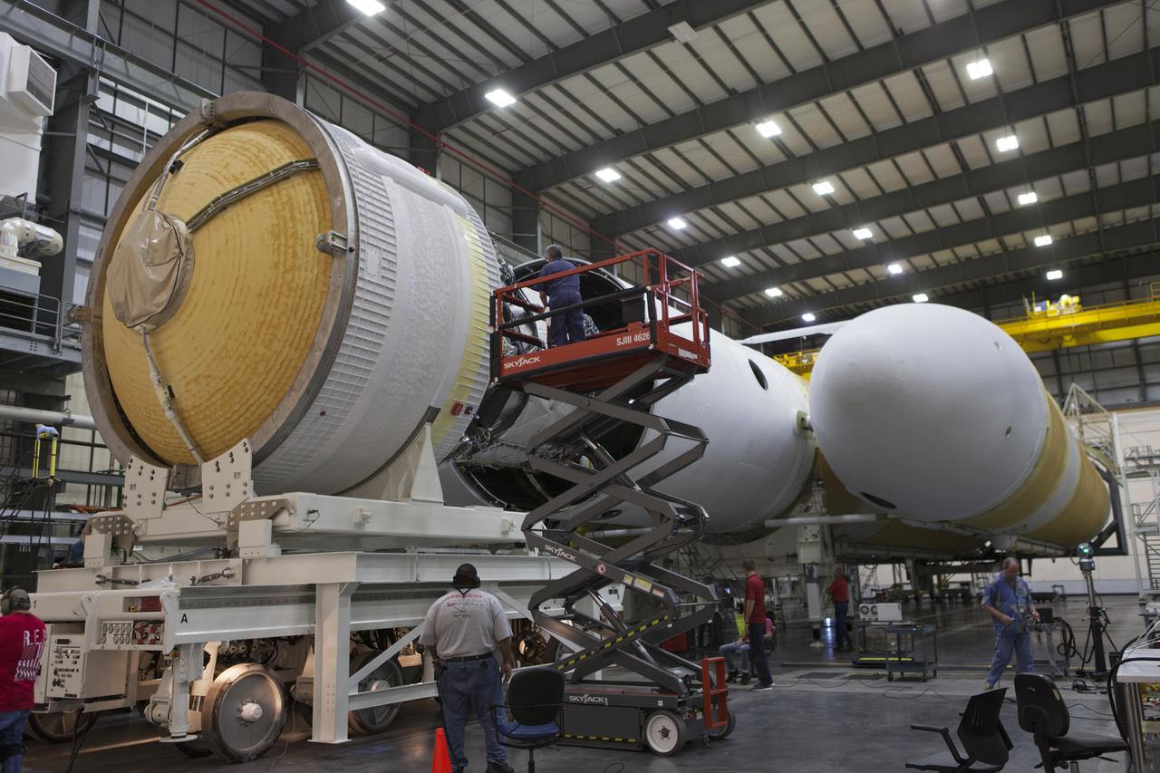 The second stage of a United Launch Alliance Delta IV Heavy is being mated to the common booster core inside the Horizontal Integration Facility near Space Launch Complex 37 at Cape Canaveral Air Force Station in Florida. The Delta IV Heavy will launch NASA's upcoming Parker Solar Probe mission in July 2018. The mission will perform the closest-ever observations of a star when it travels through the Sun's atmosphere, called the corona. The probe will rely on measurements and imaging to revolutionize our understanding of the corona and the Sun-Earth connection.