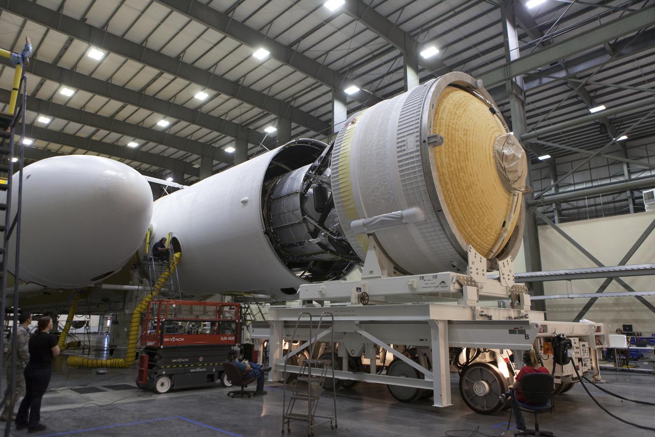 The second stage of a United Launch Alliance Delta IV Heavy is being mated to the common booster core inside the Horizontal Integration Facility near Space Launch Complex 37 at Cape Canaveral Air Force Station in Florida. The Delta IV Heavy will launch NASA's upcoming Parker Solar Probe mission in July 2018. The mission will perform the closest-ever observations of a star when it travels through the Sun's atmosphere, called the corona. The probe will rely on measurements and imaging to revolutionize our understanding of the corona and the Sun-Earth connection.