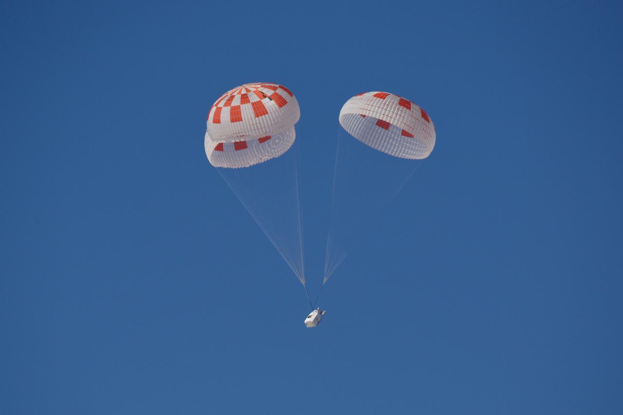 SpaceX performed its fourteenth overall parachute test supporting Crew Dragon development. This most recent exercise was the first of several planned parachute system qualification tests ahead of the spacecraft’s first crewed flight and resulted in the successful touchdown of Crew Dragon’s parachute system. During this test, a C-130 aircraft transported the parachute test vehicle, designed to achieve the maximum speeds that Crew Dragon could experience on re-entry, over the Mojave Desert in Southern California and dropped the vehicle from an altitude of 25,000 feet. The test demonstrated an off-nominal situation, deploying only one of the two drogue chutes and intentionally skipping a reefing stage on one of the four main parachutes, proving a safe landing in such a contingency scenario.