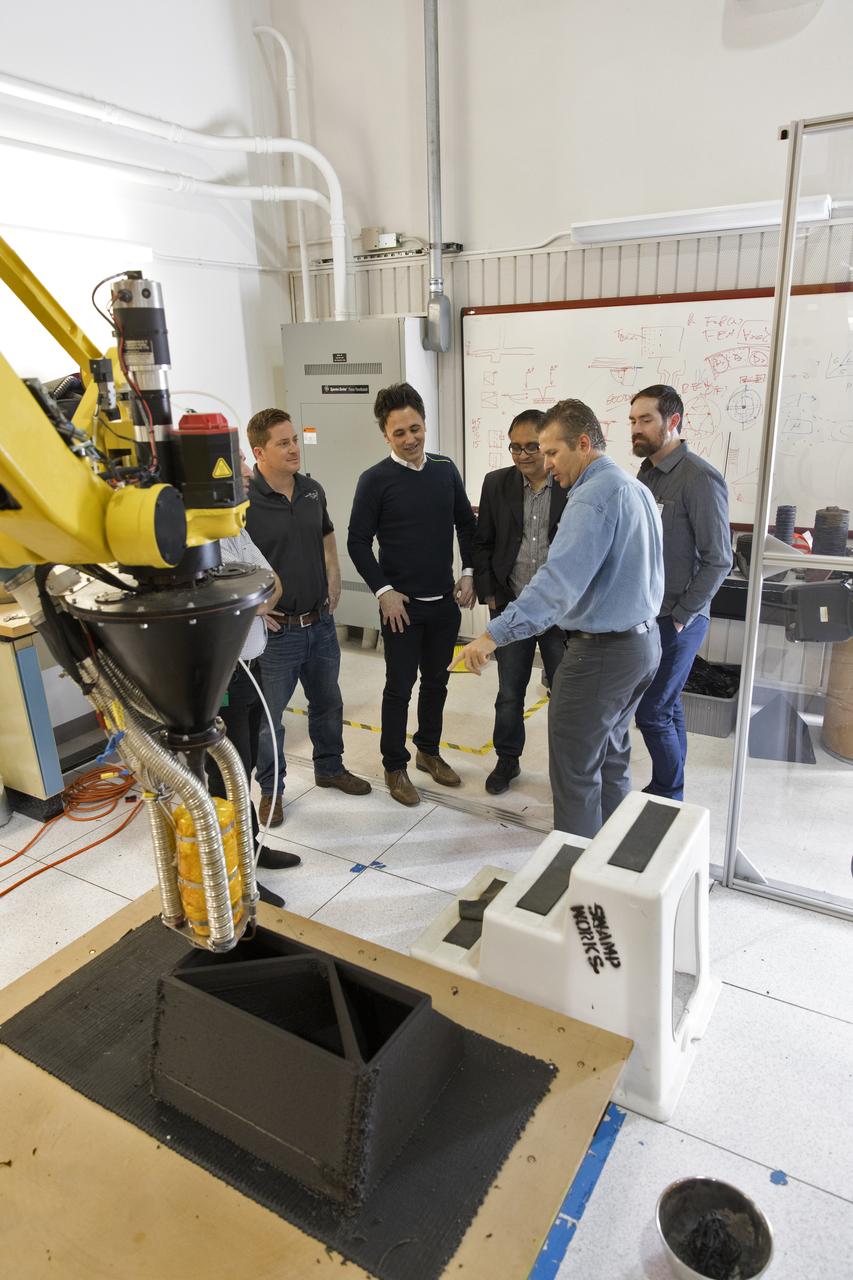 Researchers at NASA's Kennedy Space Center in Florida are developing a Zero Launch Mass 3-D printer at the center's Swamp Works. The printer can be used for construction projects on the Moon and Mars. Zero launch mass refers to the fact that the printer uses pellets made from simulated lunar regolith, or dirt, and polymers. This will prove that space explorers can use resources at their destination instead of taking everything with them, saving them launch mass and money. The Kennedy team is working with Marshall Space Flight Center in Huntsville, Alabama, and the U.S. Army Corps of Engineers to develop a system that can 3-D print barracks in remote locations on Earth, using the resources they have where they are.