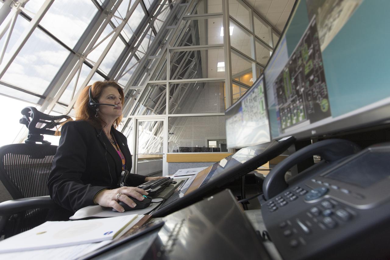 NASA Launch Director Charlie Blackwell-Thompson follows operations at her console in Firing Room 1 at the Kennedy Space Center's Launch Control Center during a countdown simulation for Exploration Mission 1. It was the agency's first simulation of a portion of the countdown for the first launch of a Space Launch System rocket and Orion spacecraft that will eventually take astronauts beyond low-Earth orbit to destinations such as the Moon and Mars.