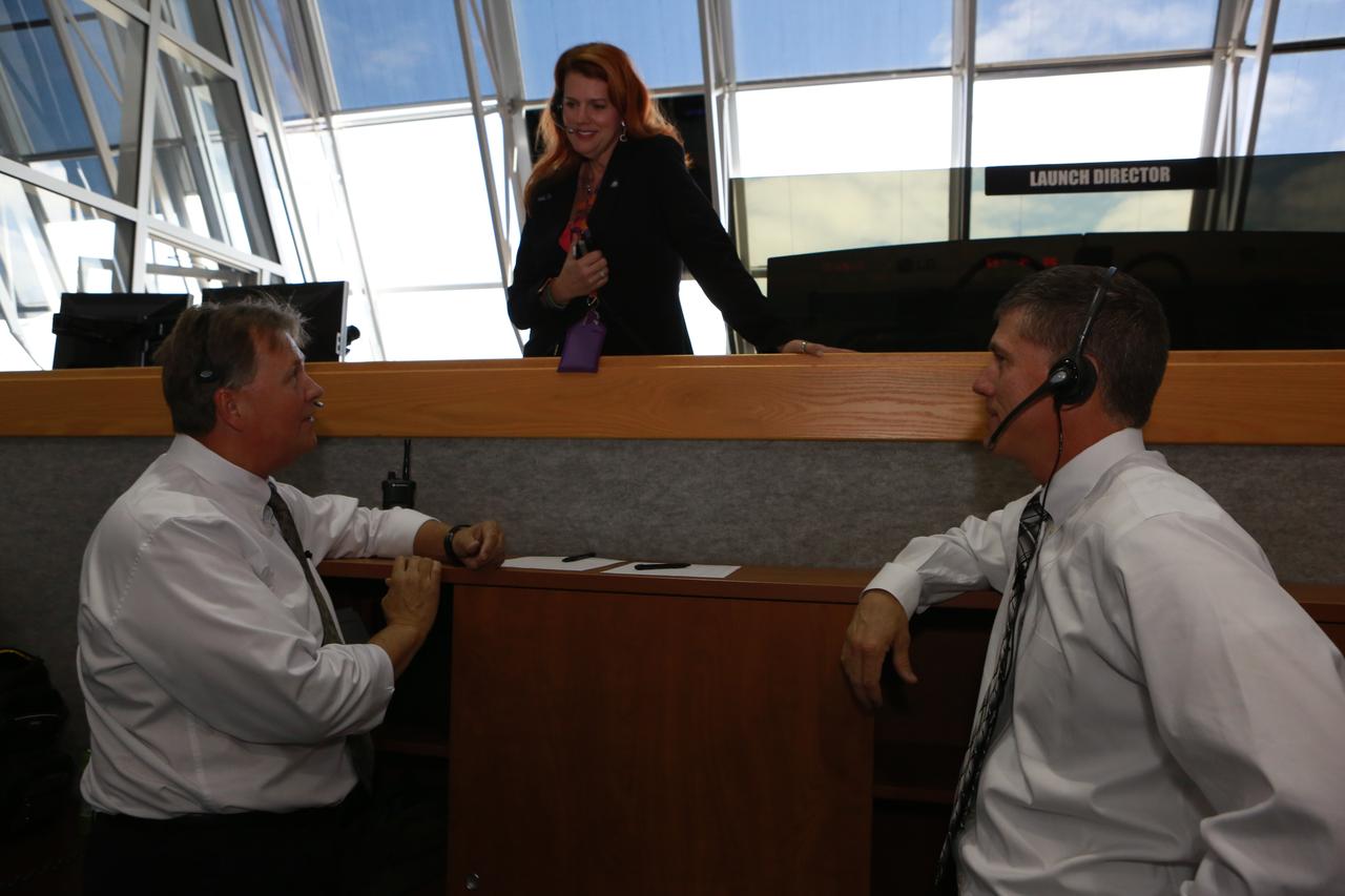 NASA Launch Director Charlie Blackwell-Thompson, above, confers with Senior NASA Test Director Jeff Spaulding, left, and Chief NASA Test Director Jeremy Graeber in Firing Room 1 at the Kennedy Space Center's Launch Control Center during a countdown simulation for Exploration Mission 1. It was the agency's first simulation of a portion of the countdown for the first launch of a Space Launch System rocket and Orion spacecraft that will eventually take astronauts beyond low-Earth orbit to destinations such as the Moon and Mars.