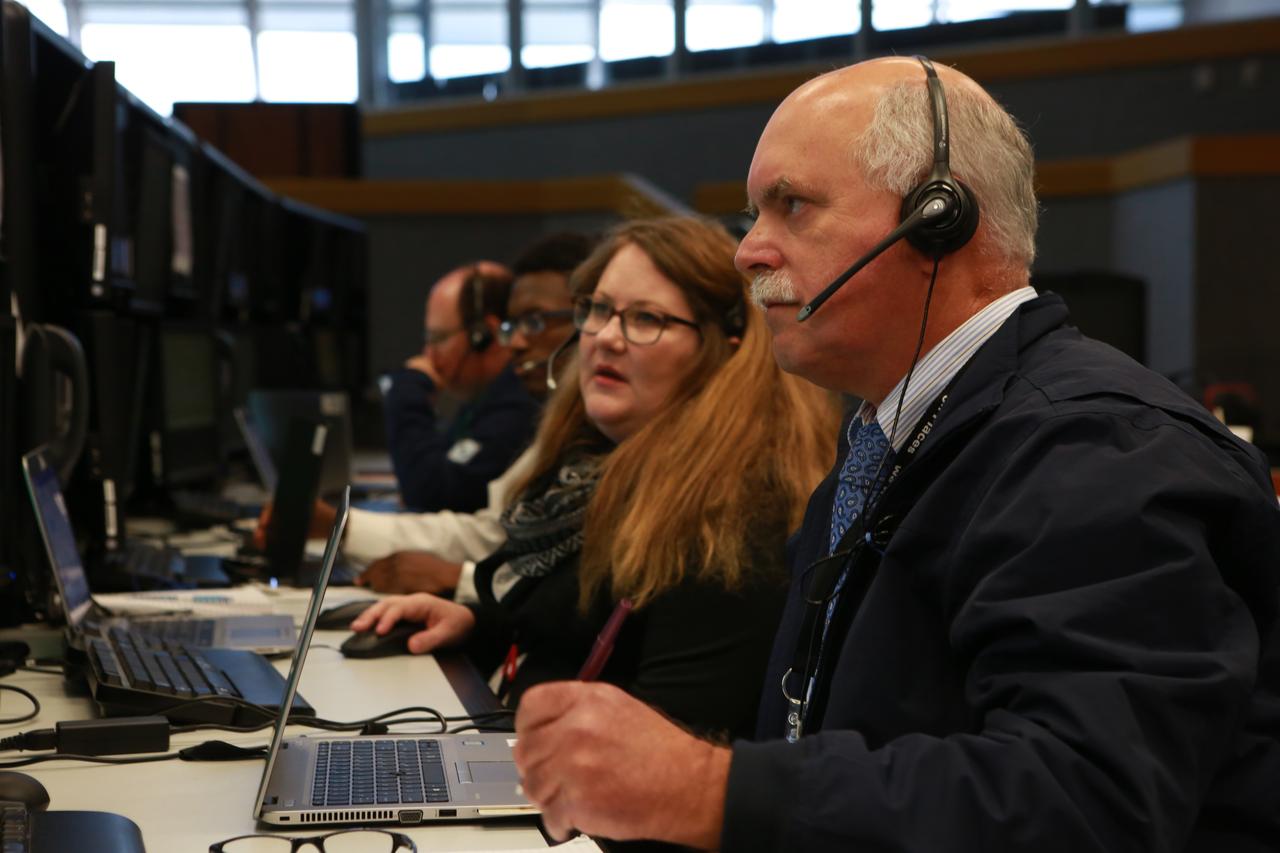 Master Console Operators Andrea Oneill, left and David Walsh, monitor operations from their positions in Firing Room 1 at the Kennedy Space Center's Launch Control Center during a countdown simulation for Exploration Mission 1. It was the agency's first simulation of a portion of the countdown for the first launch of a Space Launch System rocket and Orion spacecraft that will eventually take astronauts beyond low-Earth orbit to destinations such as the Moon and Mars.