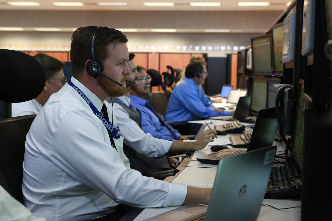 Alex Higgins, a liquid hydrogen operations engineer with Jacobs, monitors operations from his position in Firing Room 1 at the Kennedy Space Center's Launch Control Center during a countdown simulation for Exploration Mission 1. It was the agency's first simulation of a portion of the countdown for the first launch of a Space Launch System rocket and Orion spacecraft that will eventually take astronauts beyond low-Earth orbit to destinations such as the Moon and Mars.