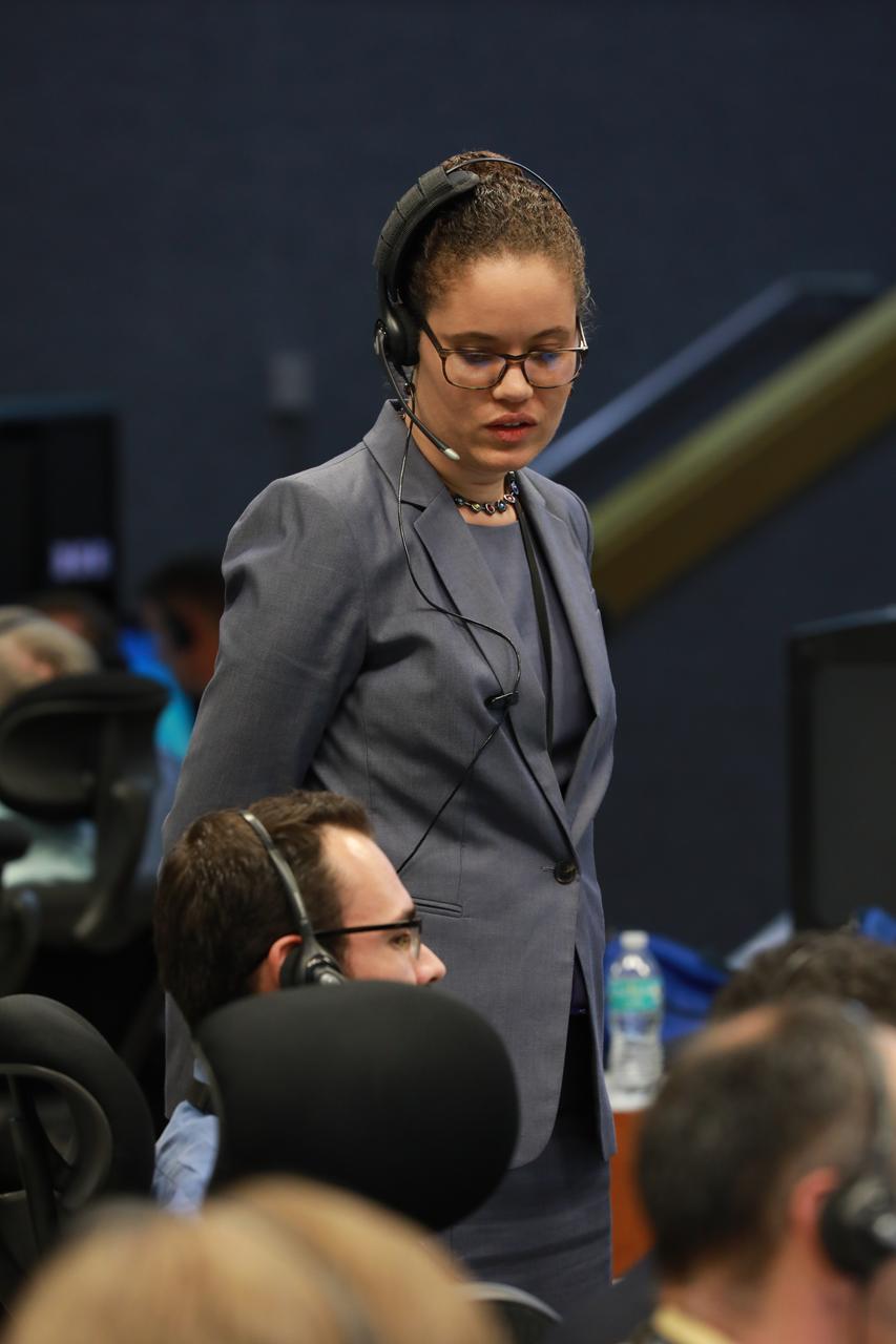 NASA Test Director Christine St. Germain monitors operations in Firing Room 1 at the Kennedy Space Center's Launch Control Center during a countdown simulation for Exploration Mission 1. It was the agency's first simulation of a portion of the countdown for the first launch of a Space Launch System rocket and Orion spacecraft that will eventually take astronauts beyond low-Earth orbit to destinations such as the Moon and Mars.