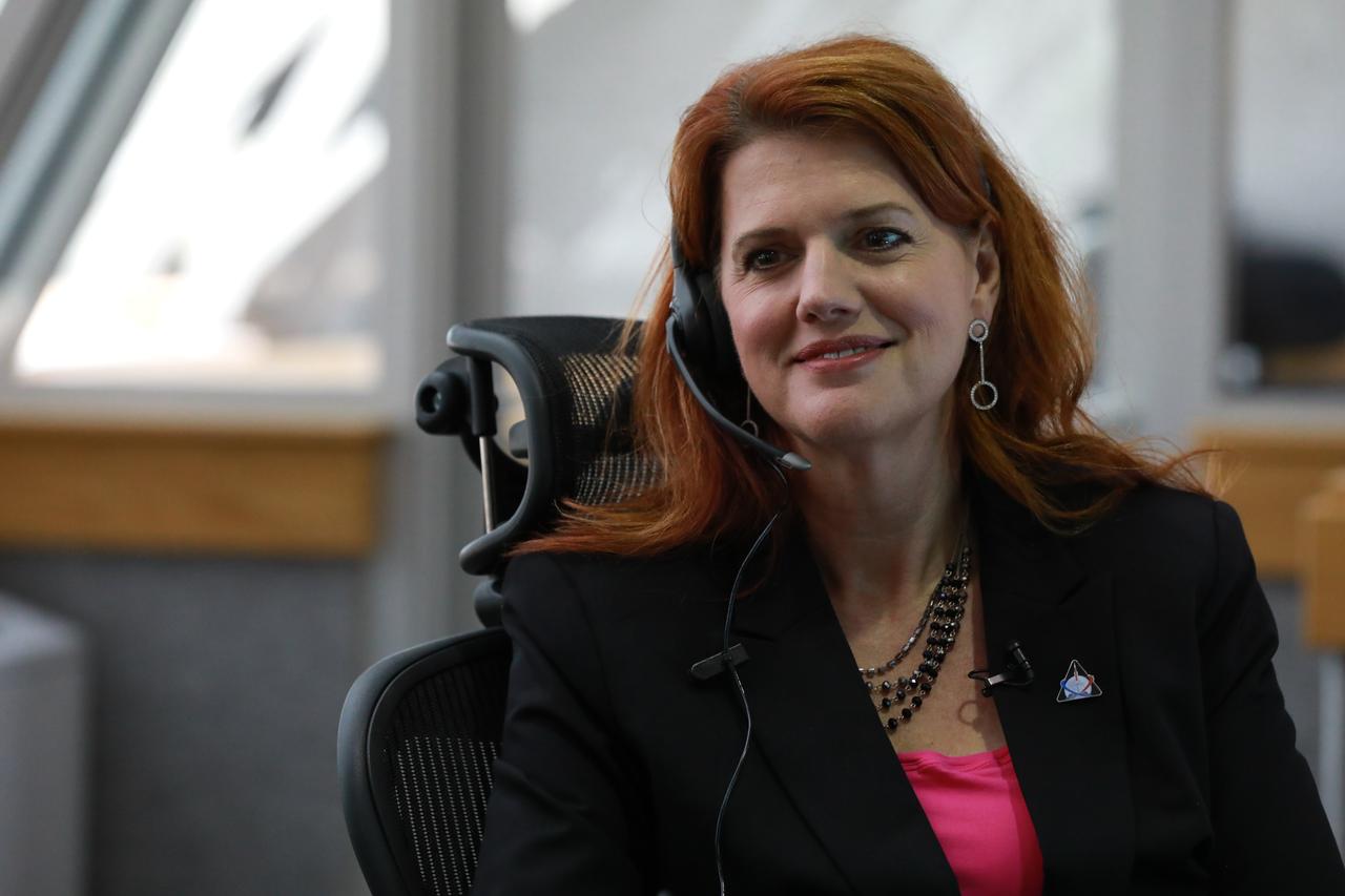 NASA Launch Director Charlie Blackwell-Thompson follows operations at her console in Firing Room 1 at the Kennedy Space Center's Launch Control Center during a countdown simulation for Exploration Mission 1. It was the agency's first simulation of a portion of the countdown for the first launch of a Space Launch System rocket and Orion spacecraft that will eventually take astronauts beyond low-Earth orbit to destinations such as the Moon and Mars.