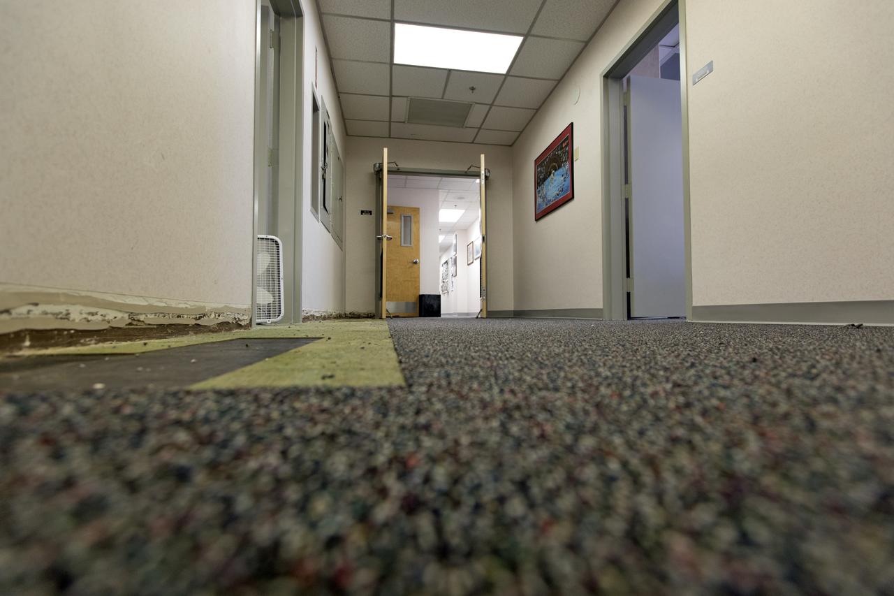 Modifications and upgrades are underway inside the Astronaut Crew Quarters in the Neil Armstrong Operations and Checkout Building at NASA's Kennedy Space Center in Florida. Old carpeting is being removed and new carpeting is being installed. The crew quarters are being prepared for the next generation of space explorers. The historic facility housed Apollo and space shuttle astronauts before and after their missions into space.