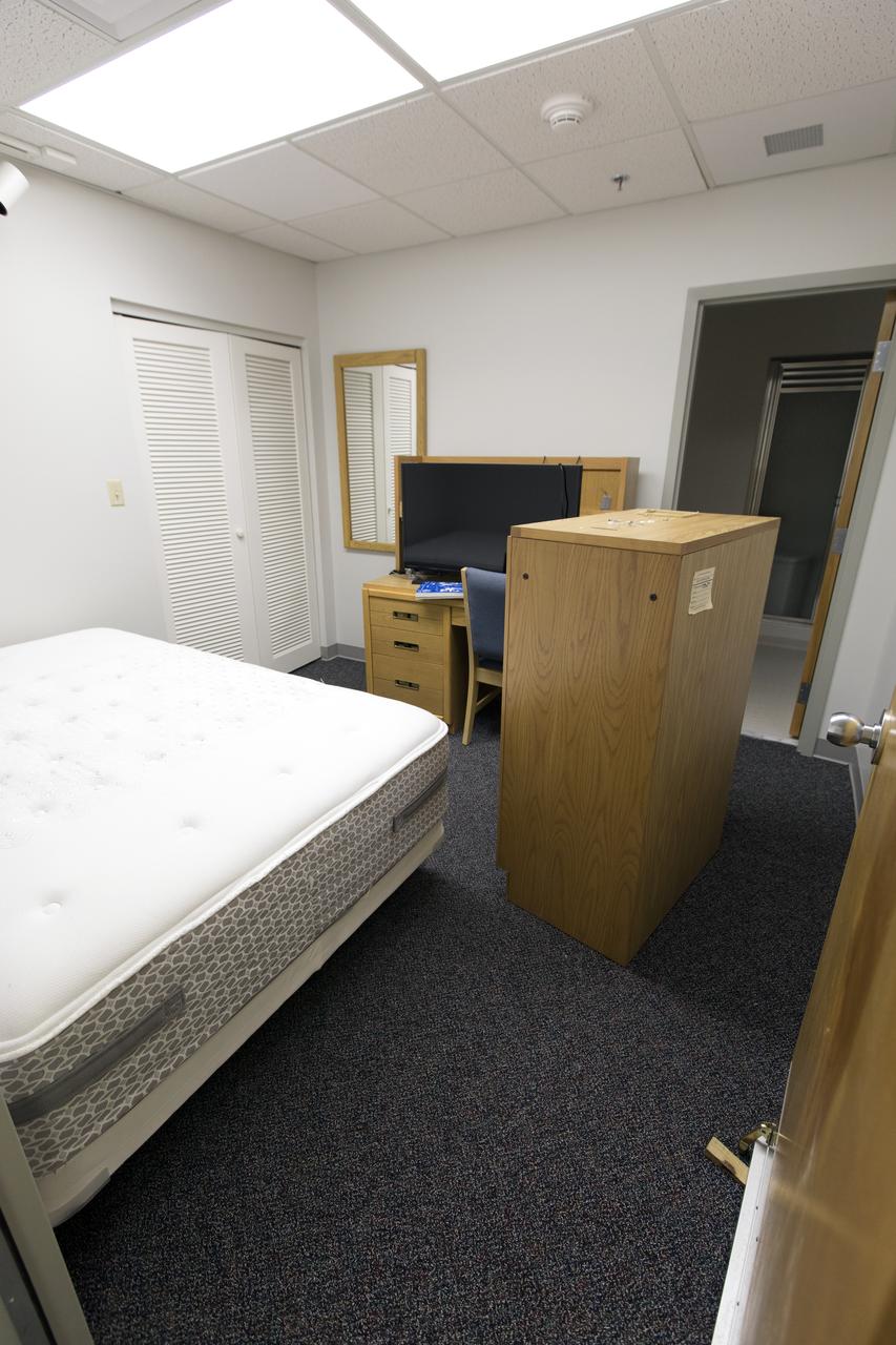 Modifications and upgrades are underway inside the Astronaut Crew Quarters in the Neil Armstrong Operations and Checkout Building at NASA's Kennedy Space Center in Florida. Walls are painted and new carpeting was installed in one of the bedrooms. The crew quarters are being prepared for the next generation of space explorers. The historic facility housed Apollo and space shuttle astronauts before and after their missions into space.