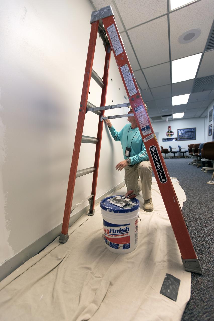 Modifications and upgrades are underway inside the Astronaut Crew Quarters in the Neil Armstrong Operations and Checkout Building at NASA's Kennedy Space Center in Florida. The walls inside the meeting room are being painted. New carpeting has been installed. The crew quarters are being prepared for the next generation of space explorers. The historic facility housed Apollo and space shuttle astronauts before and after their missions into space.