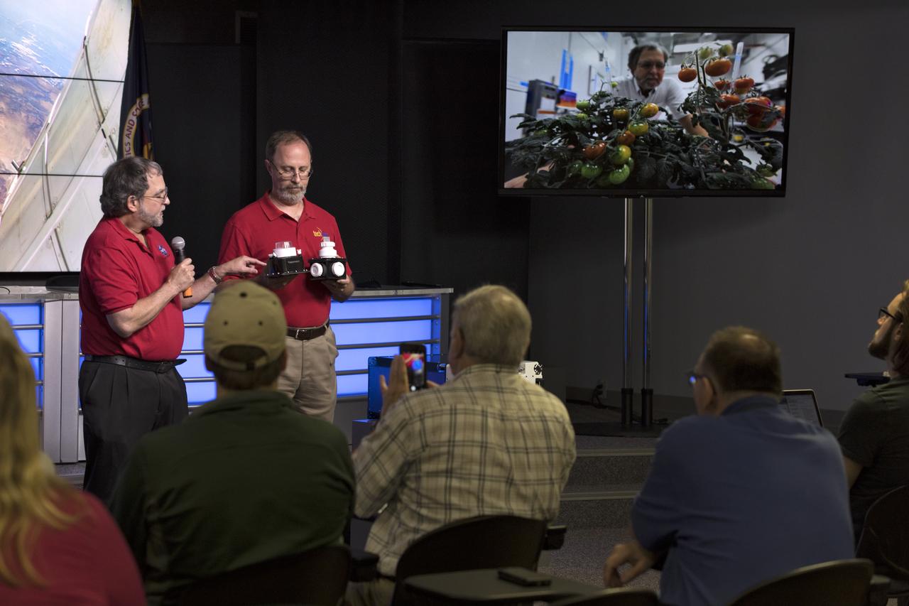 Howard Levine, at left, chief scientist in the Utilization and Life Sciences Office at NASA's Kennedy Space Center, and Dave Reid, a project manager with Techshot, discuss continuing research on growing food in space, as the Veggie Passive Orbital Nutrient Delivery System (PONDS) experiment tests a new way to deliver nutrients to plants. PONDS is one of the experiments that will be aboard a Dragon spacecraft scheduled for liftoff from Cape Canaveral Air Force Station's Space Launch Complex 40 at 4:30 p.m. EST, on April 2, 2018. The SpaceX Falcon 9 rocket will launch the company's 14th Commercial Resupply Services mission to the space station. 
