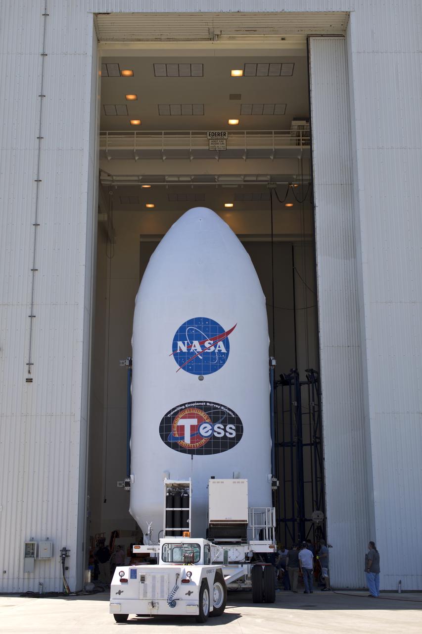 The payload fairing for NASA's Transiting Exoplanet Survey Satellite (TESS) is moved inside the Payload Hazardous Servicing Facility at the agency's Kennedy Space Center in Florida. Inside the facility, TESS will be encapsulated in the payload fairing. The satellite is scheduled to launch atop a SpaceX Falcon 9 rocket from Space Launch Complex 40 at Cape Canaveral Air Force Station on April 16. The satellite is the next step in NASA's search for planets outside our solar system, known as exoplanets. TESS is a NASA Astrophysics Explorer mission led and operated by MIT in Cambridge, Massachusetts, and managed by NASA’s Goddard Space Flight Center in Greenbelt, Maryland. Dr. George Ricker of MIT’s Kavli Institute for Astrophysics and Space Research serves as principal investigator for the mission. Additional partners include Orbital ATK, NASA’s Ames Research Center, the Harvard-Smithsonian Center for Astrophysics and the Space Telescope Science Institute. More than a dozen universities, research institutes and observatories worldwide are participants in the mission. NASA’s Launch Services Program is responsible for launch management.