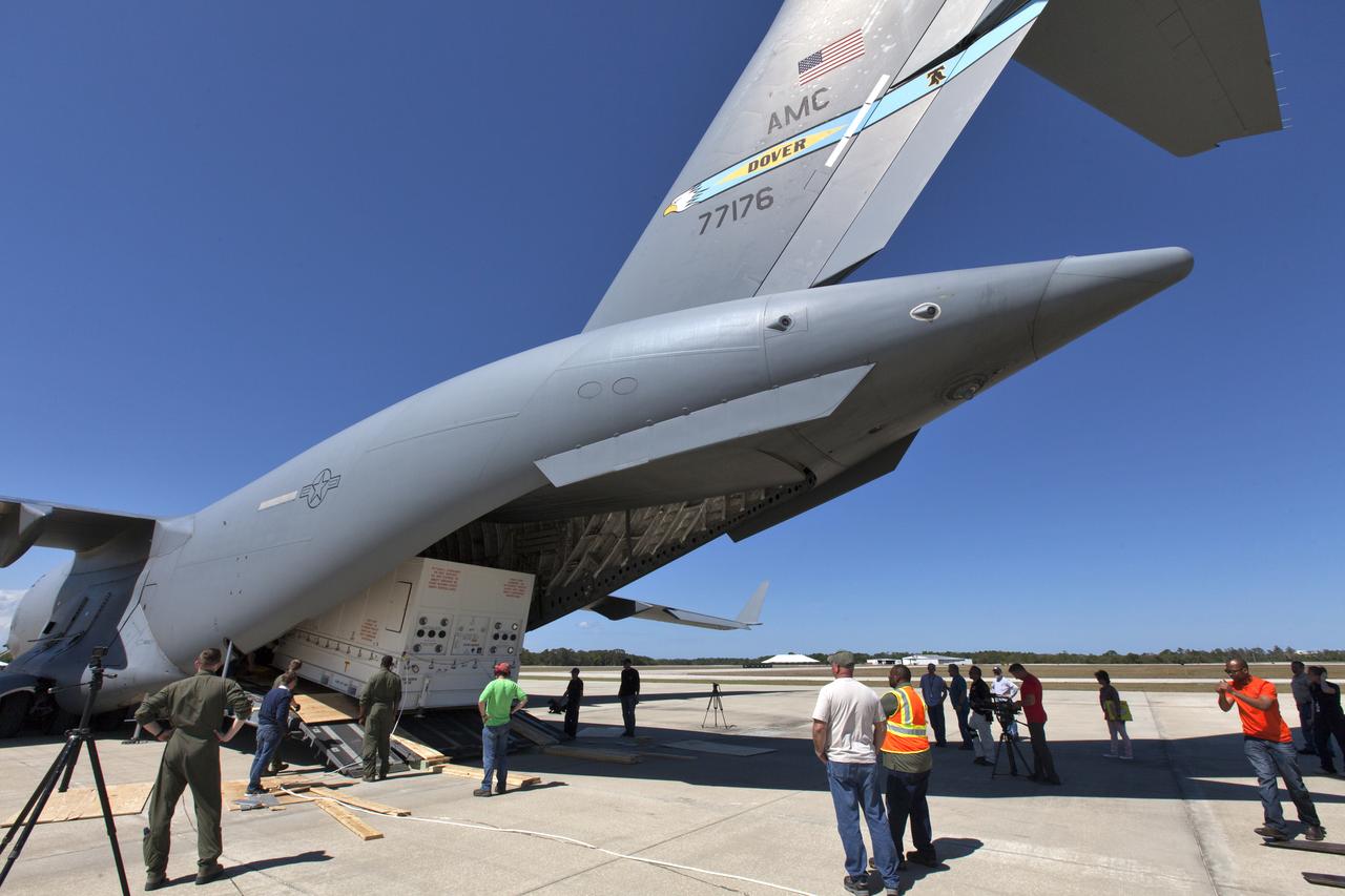 NASA's Parker Solar Probe, secured in its shipping container, is offloaded from a U.S. Air Force C-5 transport aircraft at Space Coast Regional Airport in Titusville, Florida. The spacecraft will be transported to the Astrotech processing facility near the agency's Kennedy Space Center. The Parker Solar Probe will launch on a United Launch Alliance Delta IV Heavy rocket from Space Launch Complex 37 at Cape Canaveral Air Force Station in Florida in July 2018. The mission will perform the closest-ever observations of a star when it travels through the Sun's atmosphere, called the corona. The probe will rely on measurements and imaging to revolutionize our understanding of the corona and the Sun-Earth connection. 