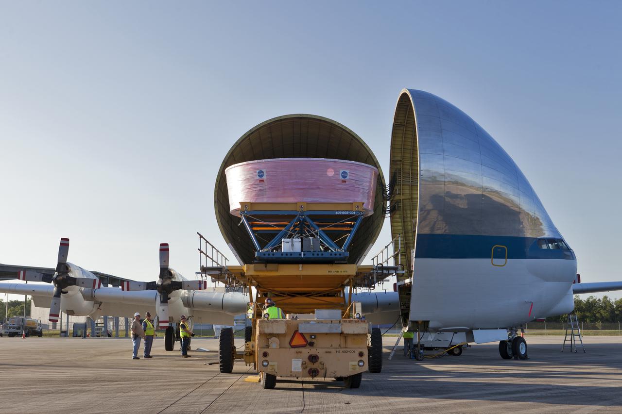 The Orion Stage Adapter (OSA) is moved out of NASA's Super Guppy aircraft onto a special payload handler at the Shuttle Landing Facility at Kennedy Space Center in Florida. The OSA is the second flight-hardware section of NASA's Space Launch System (SLS) rocket to arrive at Kennedy. The OSA will connect the Orion spacecraft to the upper part of the SLS, the interim cryogenic propulsion stage (ICPS). Both the OSA and ICPS are being stored for processing in the center's Space Station Processing Facility in preparation for Exploration Mission-1, the first uncrewed, integrated launch of the SLS rocket and Orion spacecraft. 
