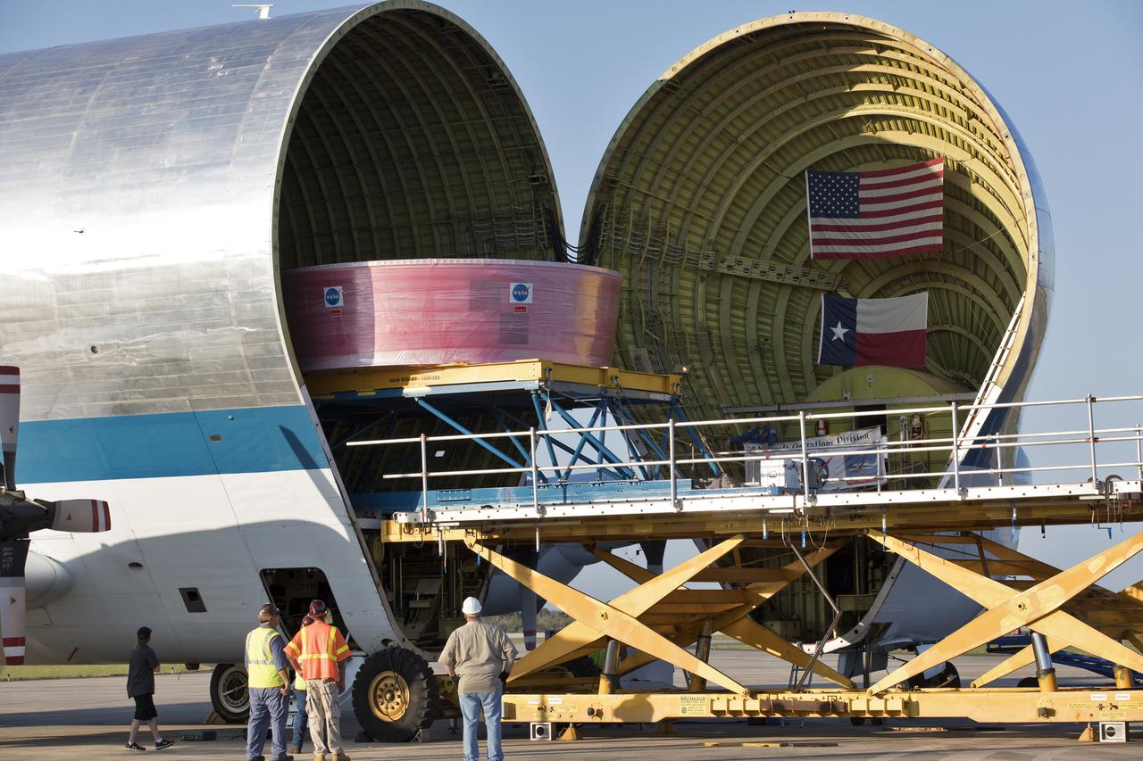 The Orion Stage Adapter (OSA) is moved out of NASA's Super Guppy aircraft onto a special payload handler at the Shuttle Landing Facility at Kennedy Space Center in Florida. The OSA is the second flight-hardware section of NASA's Space Launch System (SLS) rocket to arrive at Kennedy. The OSA will connect the Orion spacecraft to the upper part of the SLS, the interim cryogenic propulsion stage (ICPS). Both the OSA and ICPS are being stored for processing in the center's Space Station Processing Facility in preparation for Exploration Mission-1, the first uncrewed, integrated launch of the SLS rocket and Orion spacecraft.