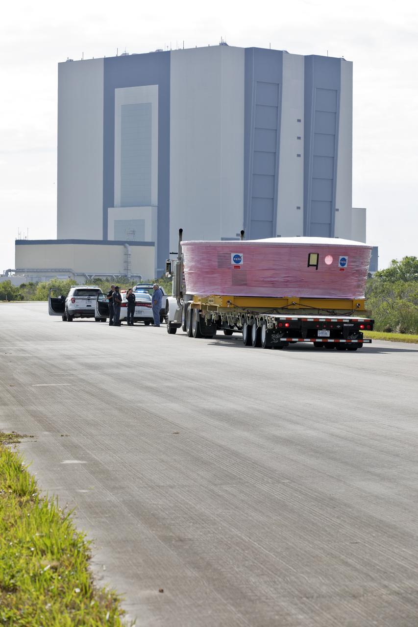 NASA Kennedy Space Center security officers prepare to escort the Orion Stage Adapter (OSA), secured on a flatbed transporter, along State Road 3 to the Space Station Processing Facility (SSPF) at NASA's Kennedy Space Center in Florida. The OSA is the second flight-hardware section of the agency's Space Launch System (SLS) rocket to arrive at Kennedy. The OSA will connect the Orion spacecraft to the upper part of the SLS, the interim cryogenic propulsion stage (ICPS). Both the OSA and ICPS are being stored for processing in the SSPF in preparation for Exploration Mission-1, the first uncrewed, integrated launch of the SLS rocket and Orion spacecraft. 