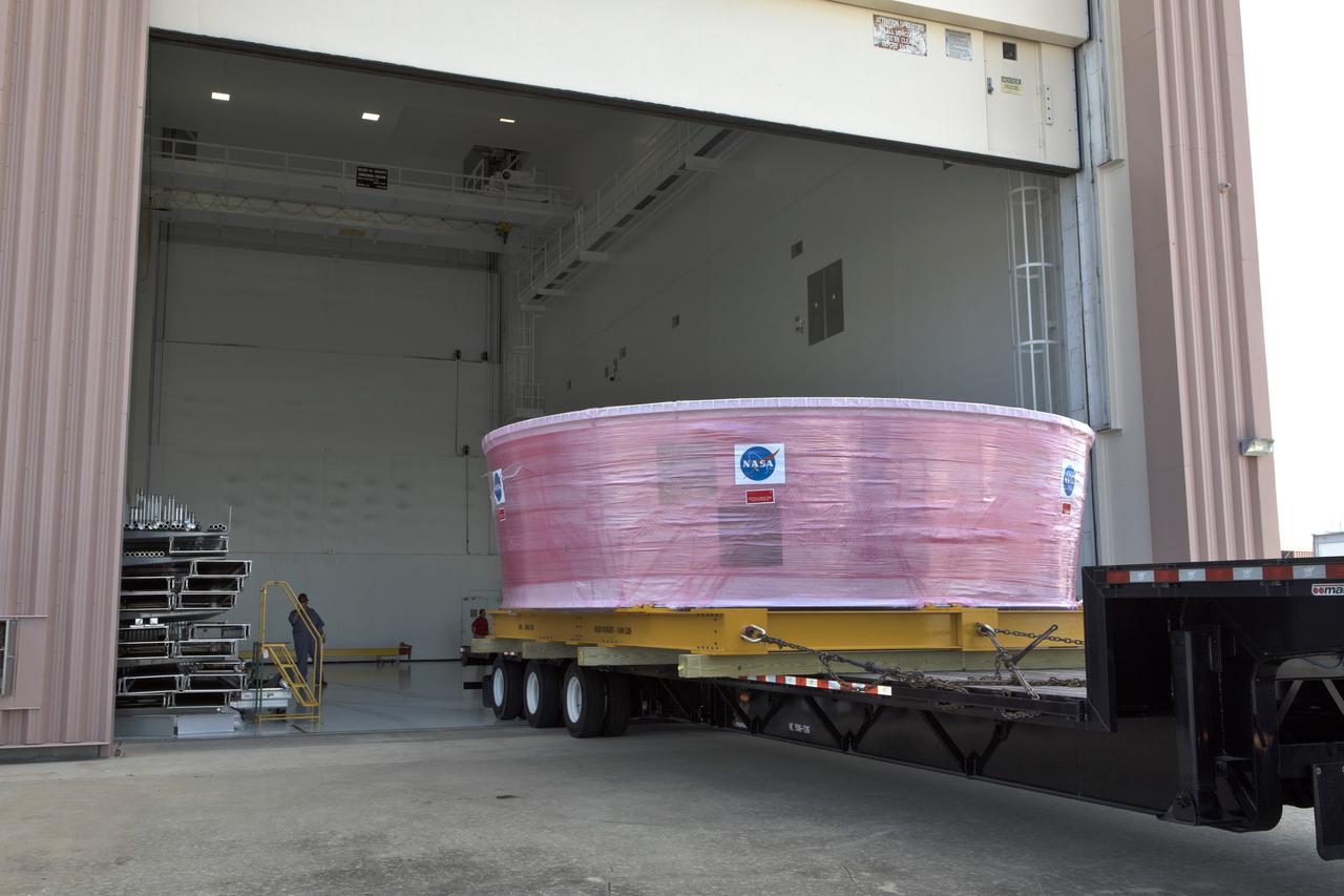 The Orion Stage Adapter (OSA), secured on flatbed transporter, is moved into the airlock at the Space Station Processing Facility (SSPF) at NASA's Kennedy Space Center in Florida. The OSA is the second flight-hardware section of the agency's Space Launch System (SLS) rocket to arrive at Kennedy. The OSA will connect the Orion spacecraft to the upper part of the SLS, the interim cryogenic propulsion stage (ICPS). Both the OSA and ICPS are being stored for processing in the SSPF in preparation for Exploration Mission-1, the first uncrewed, integrated launch of the SLS rocket and Orion spacecraft.